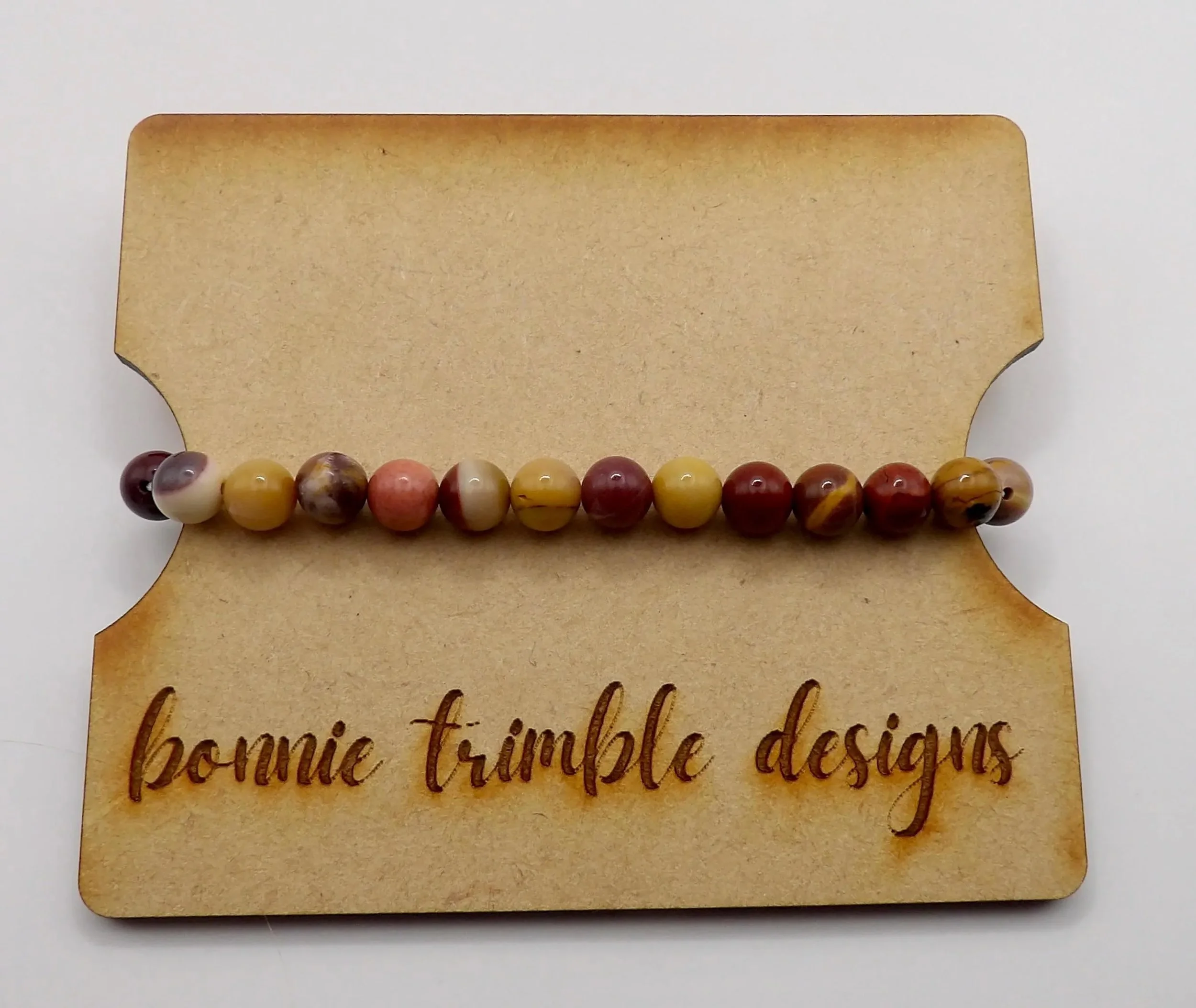 handcrafted 6mm gemstone bracelet with mookaite jasper beads, featuring a warm and organic color palette.