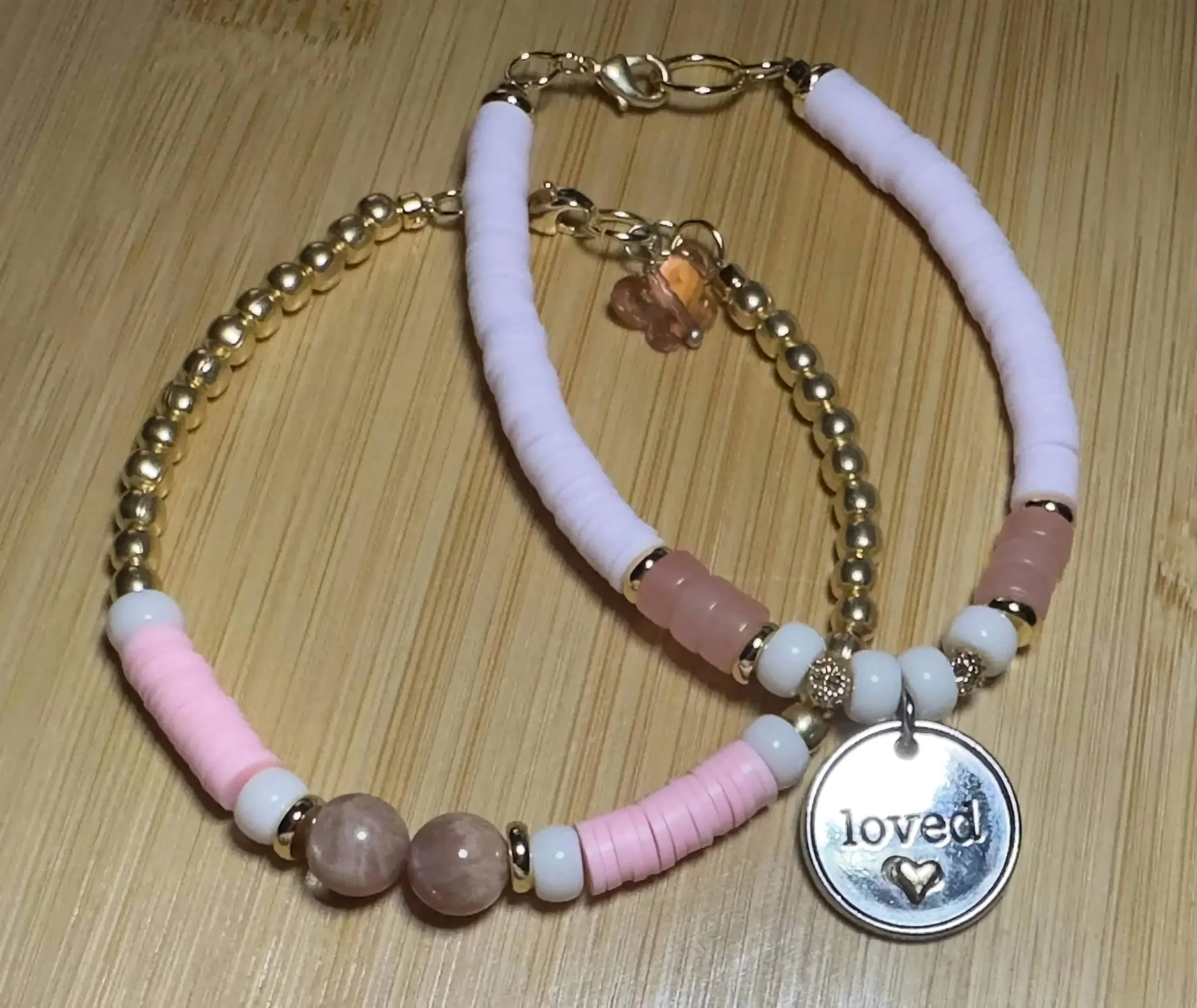 handmade sunstone, moonstone, and rose quartz beaded bracelet duo with "loved" engraved disc charm.