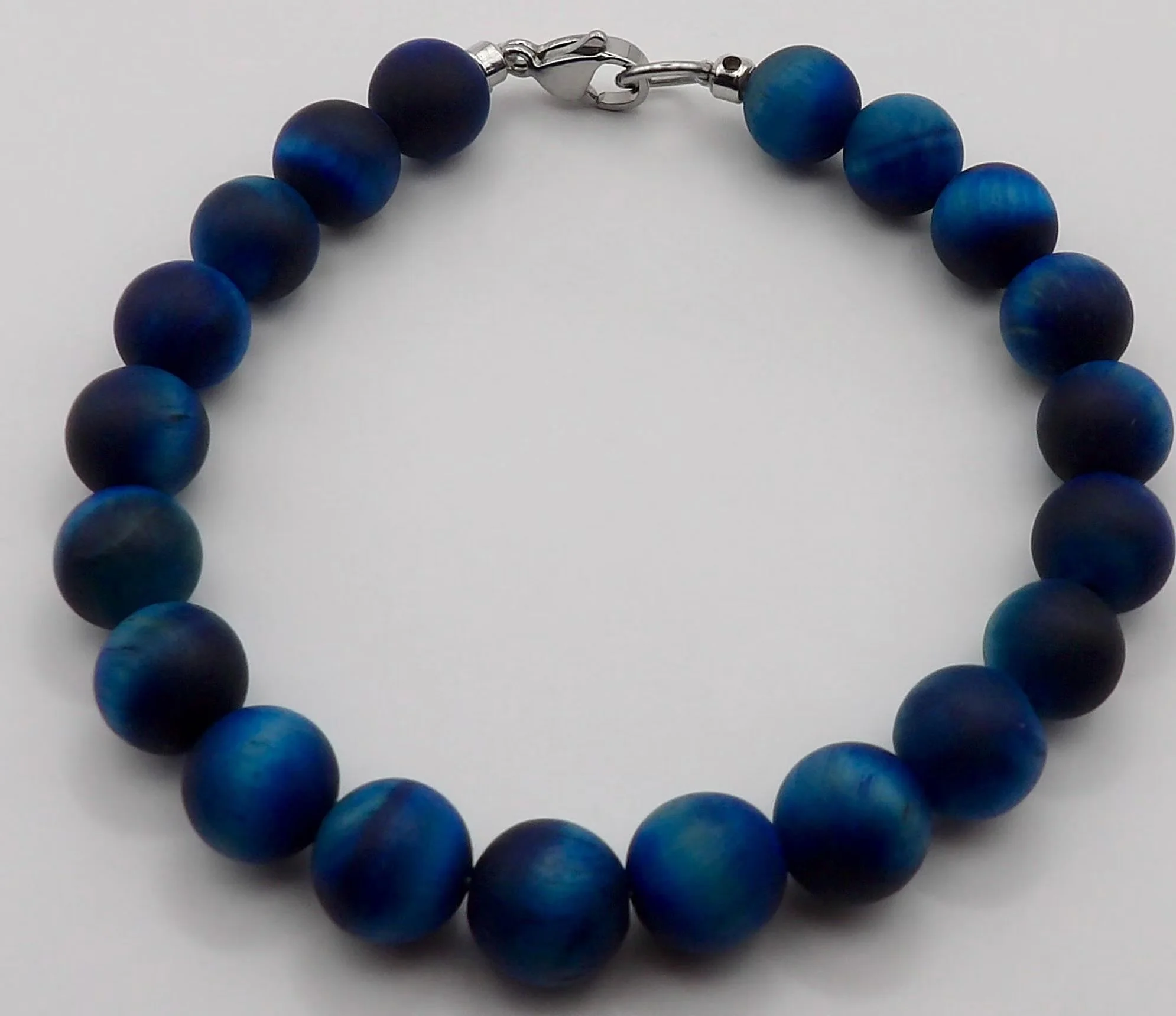 Industrial-style gemstone anchor featuring 8mm matte hawk's eye beads and tarnish-proof stainless steel components.