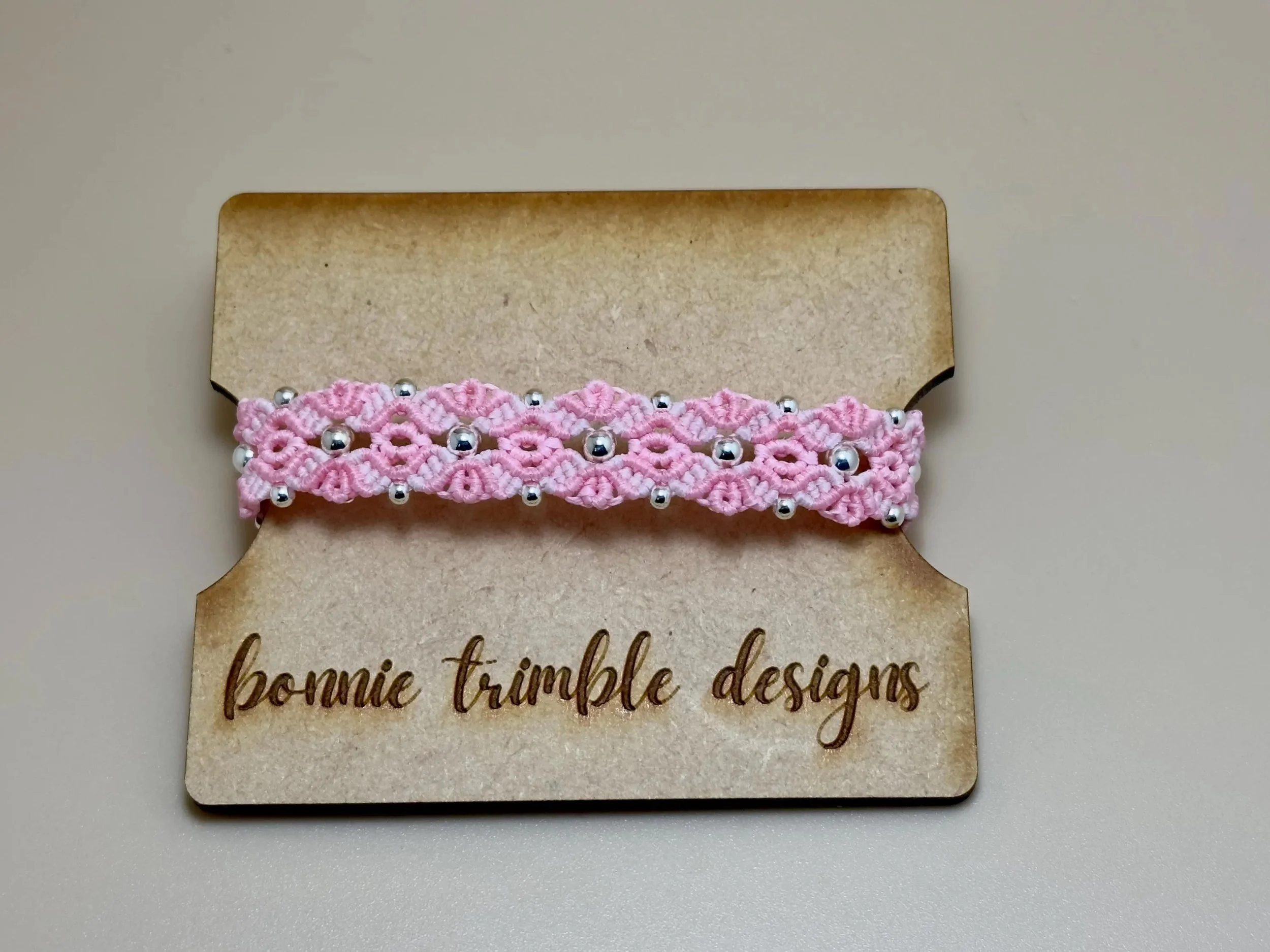 the woven bloom bracelet highlighting the intersection of traditional fiber craft and modern sterling silver luxury.