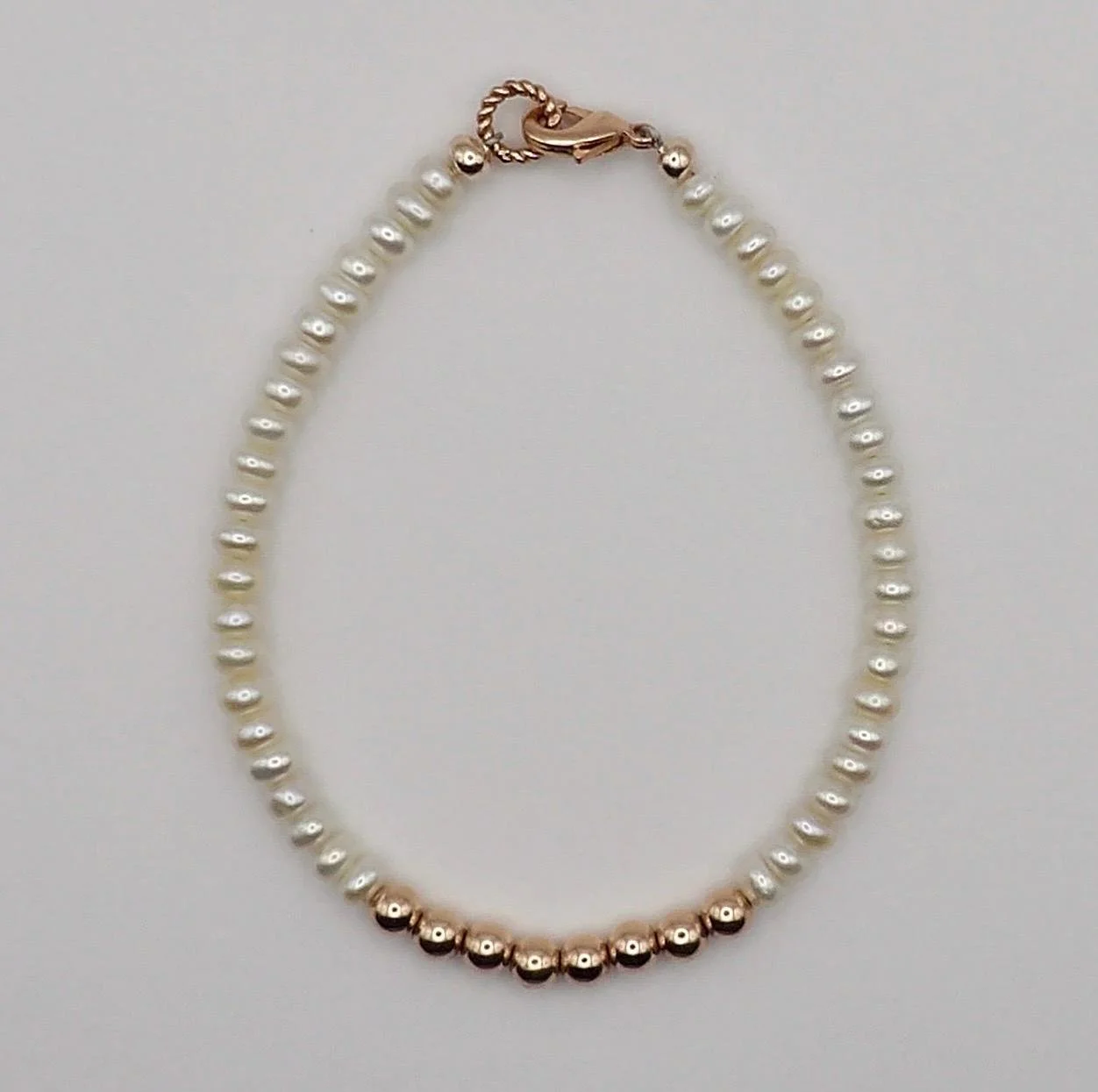 a delicate freshwater pearl stretch bracelet designed for bridal parties or elegant everyday layering.