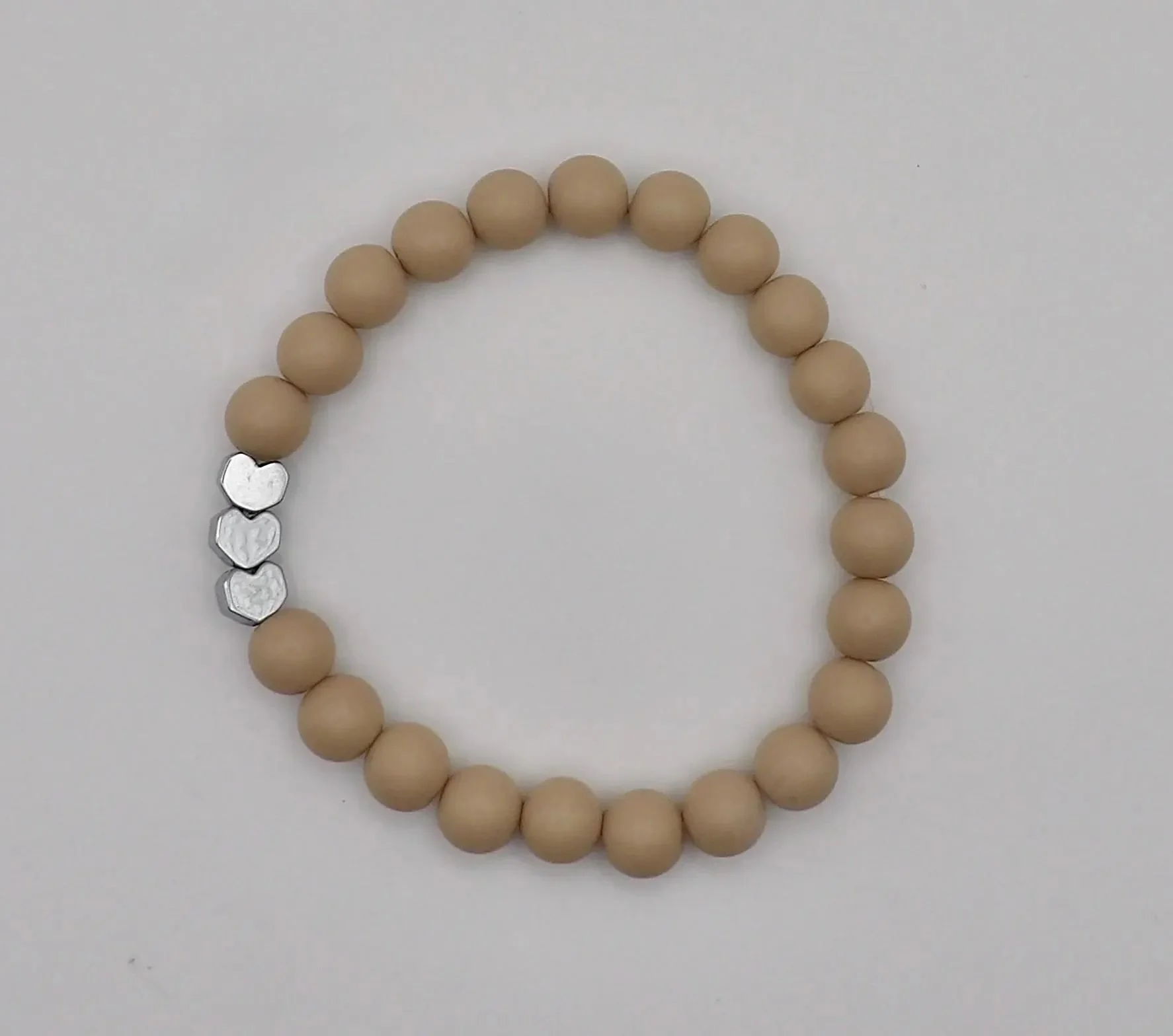 an intentional "connection" bracelet featuring matte hearts and metallic accents, ideal for best friend or bridesmaid gifts.