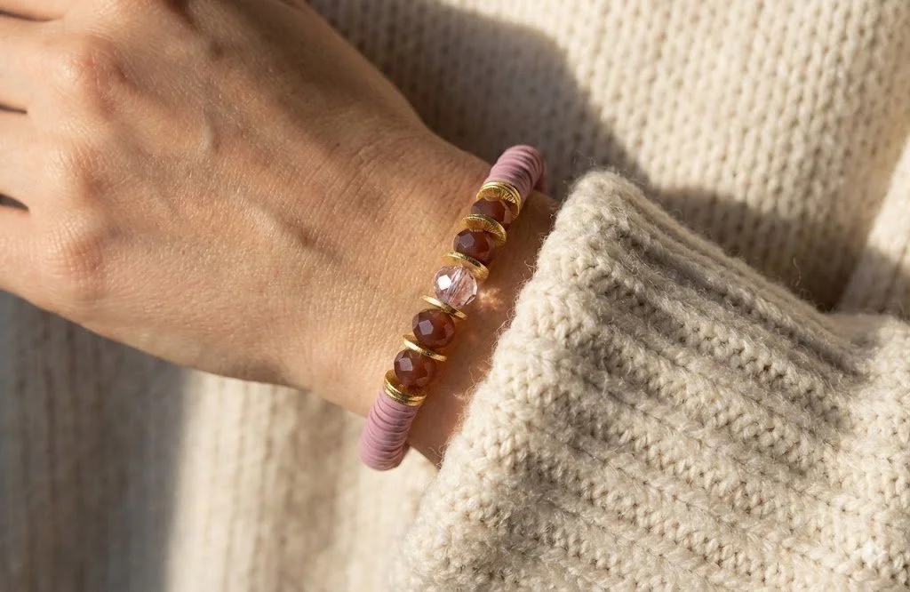 the mauve symmetry bracelet | mauve heishi beads + brushed gold accents | faceted purple centerpiece