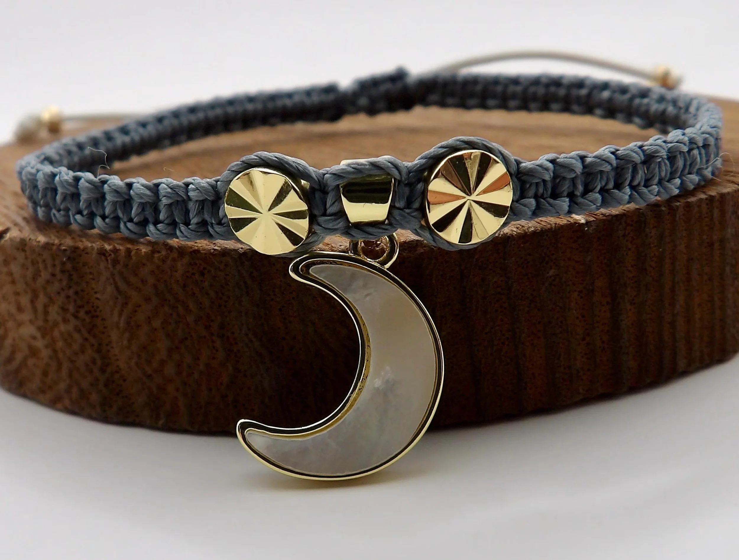 Bold charcoal gray and gold sculptural jewelry featuring intricate micro-macramé weaving and premium 18k gold plated hardware.