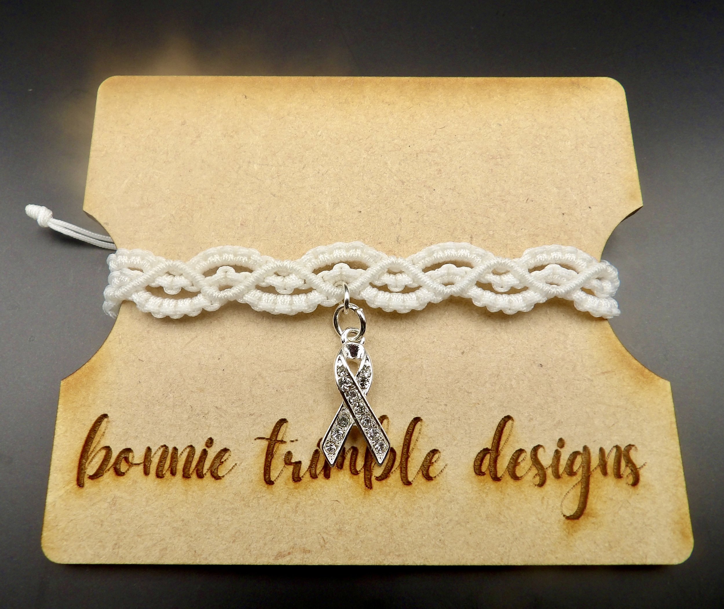 handmade white nylon micro macrame bracelet with scalloped lace weave and sterling silver crystal ribbon charm. bridal jewelry.