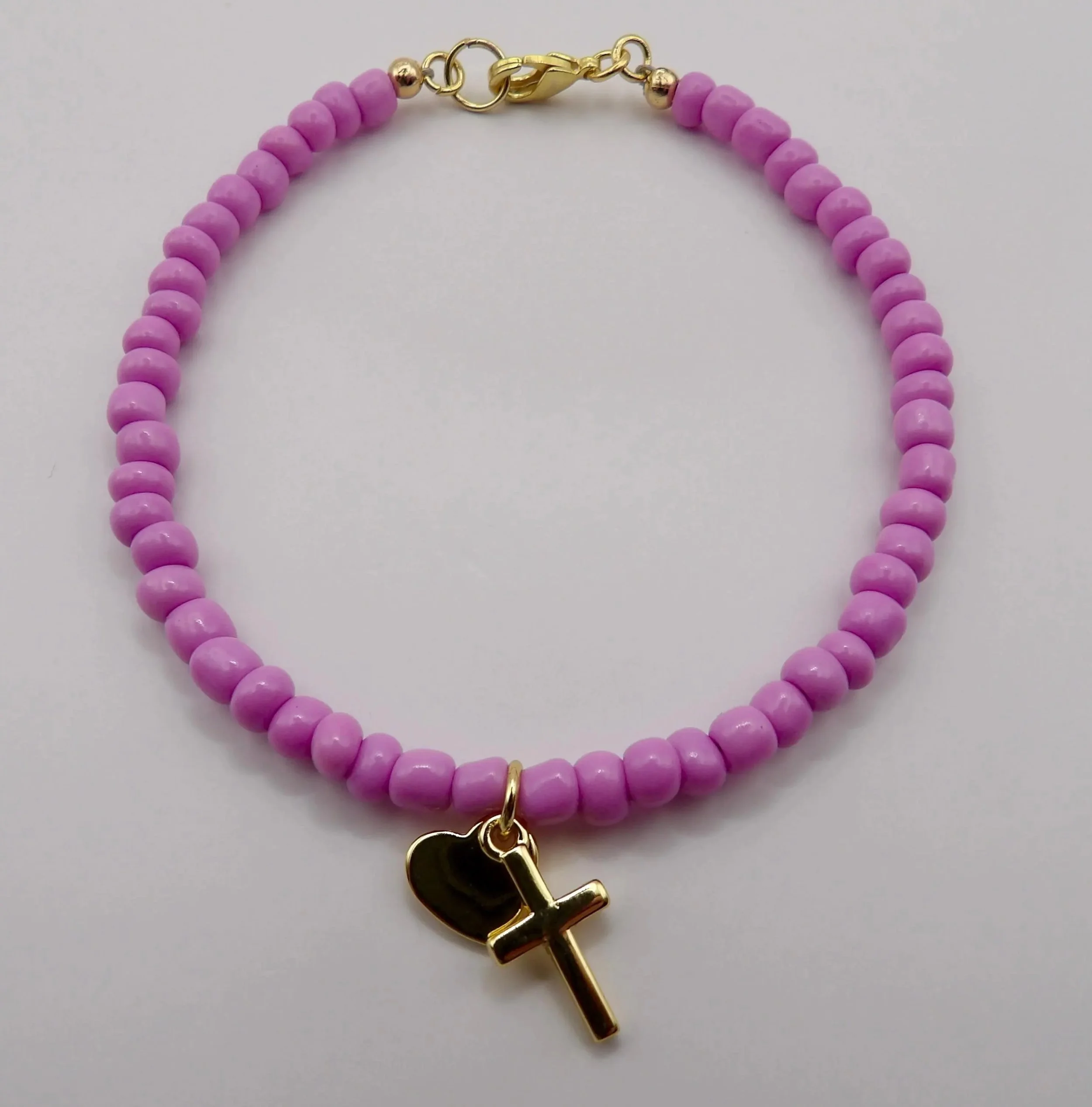 handcrafted spiritual anchor bracelet featuring small seed beads and premium 18k gold plated hardware.