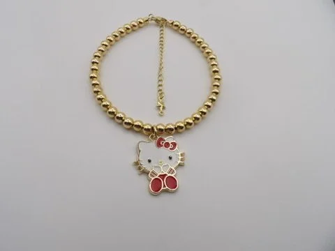 handmade 18k solid gold beaded bracelet set (friendship bracelets) showing two different 18k gold and enamel hello kitty charms.