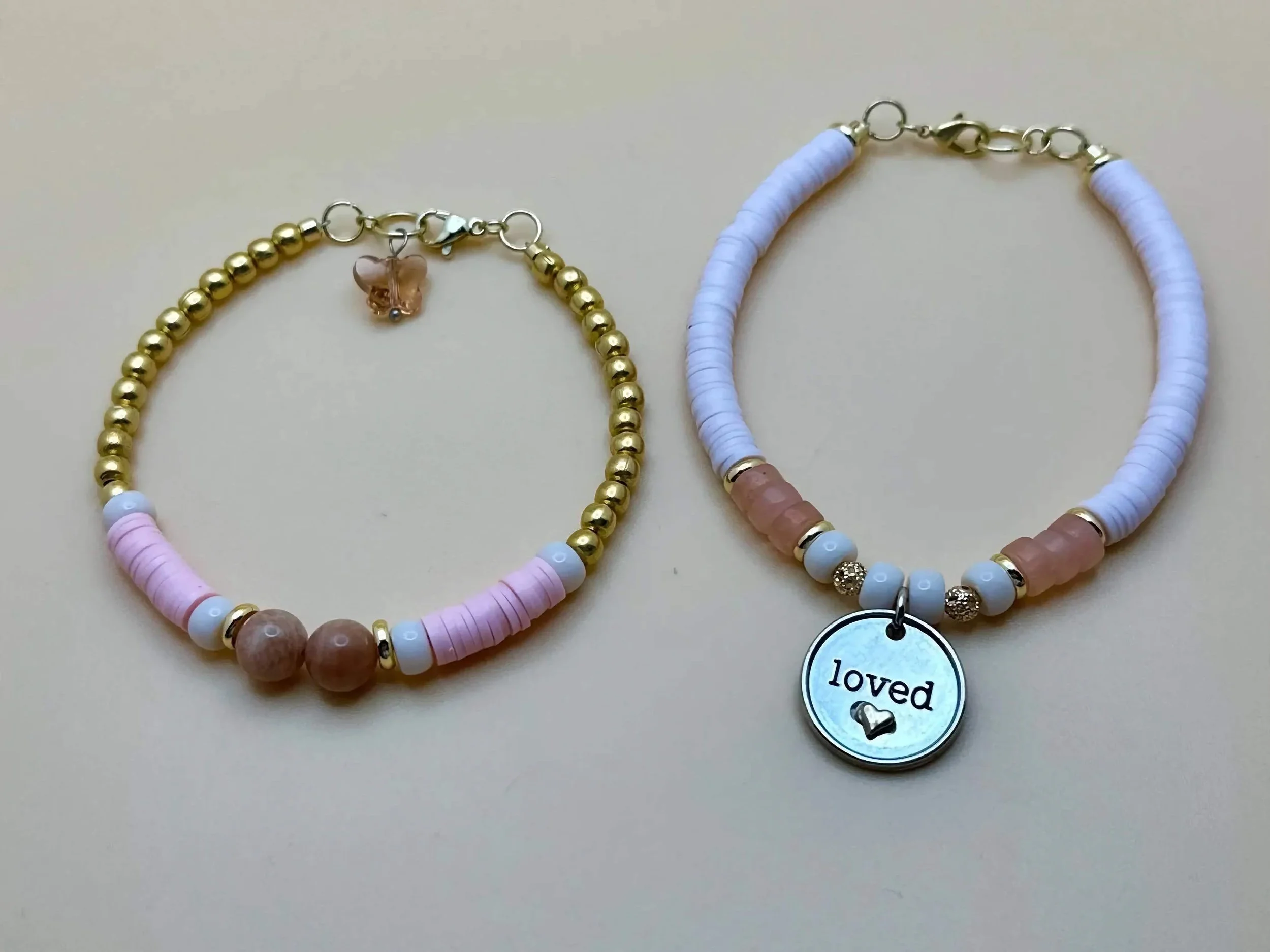 handmade sunstone, moonstone, and rose quartz beaded bracelet duo with "loved" engraved disc charm.