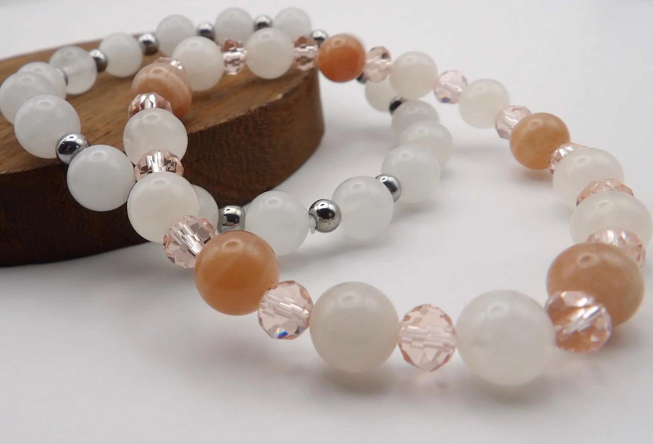 a "wellness-ready" jewelry stack combining the stabilizing energy of white jade with the calming vibes of moonstone.