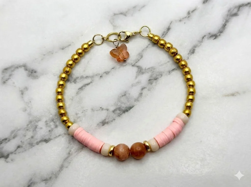 detailed view of a curated pink and orange gemstone bracelet set, designed as a symbolic "loved and lifted" gift for special occasions.