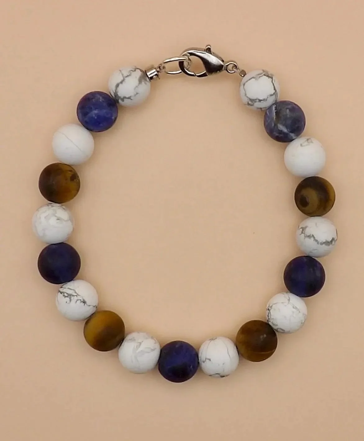 a rugged, industrial-style gemstone bracelet with 304 stainless steel accents and a mix of grounding natural stones.