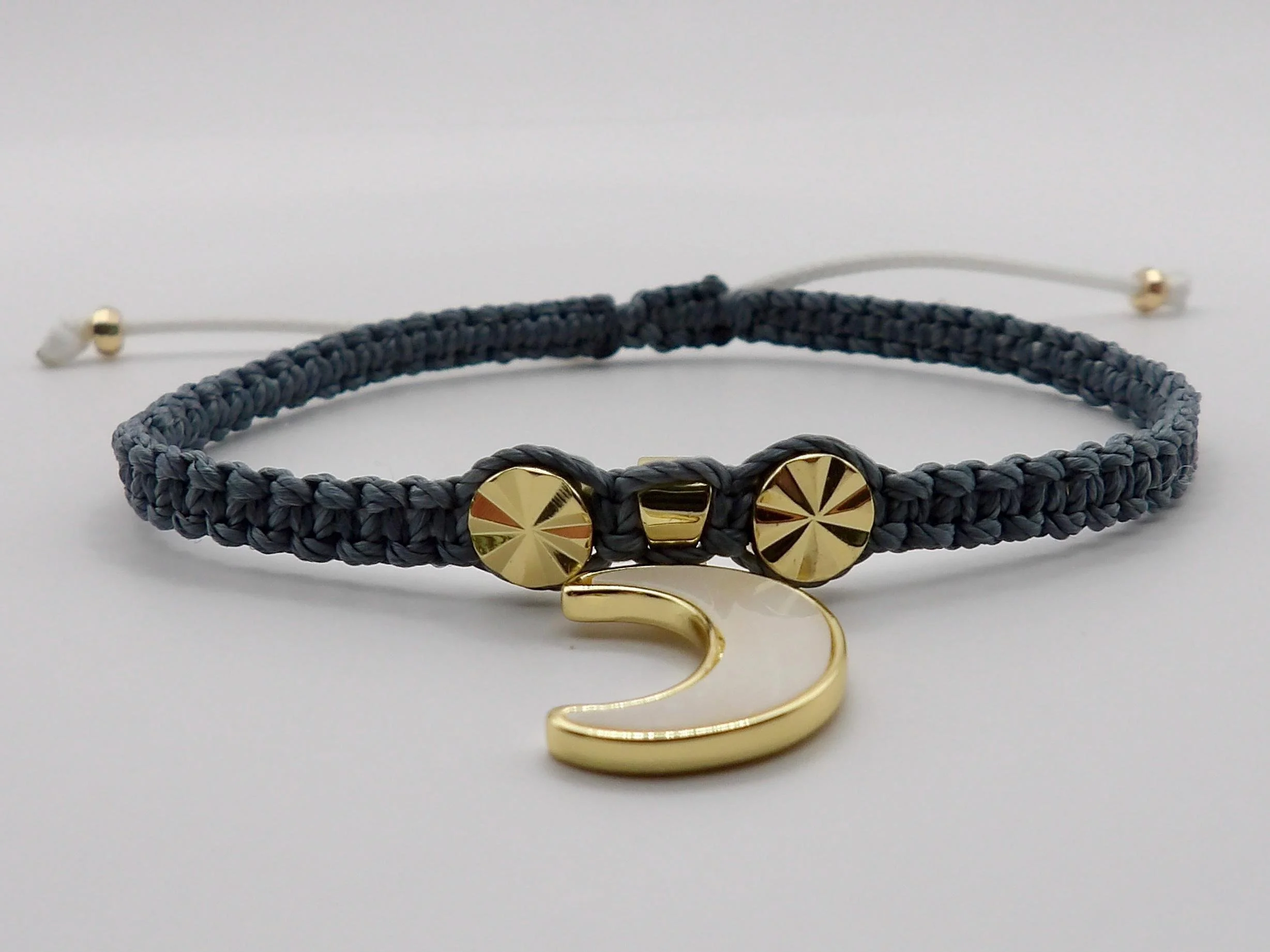 Mystical gold and gray artisan bracelet handmade in Pearland Texas featuring a celestial moon and sunburst focal point.