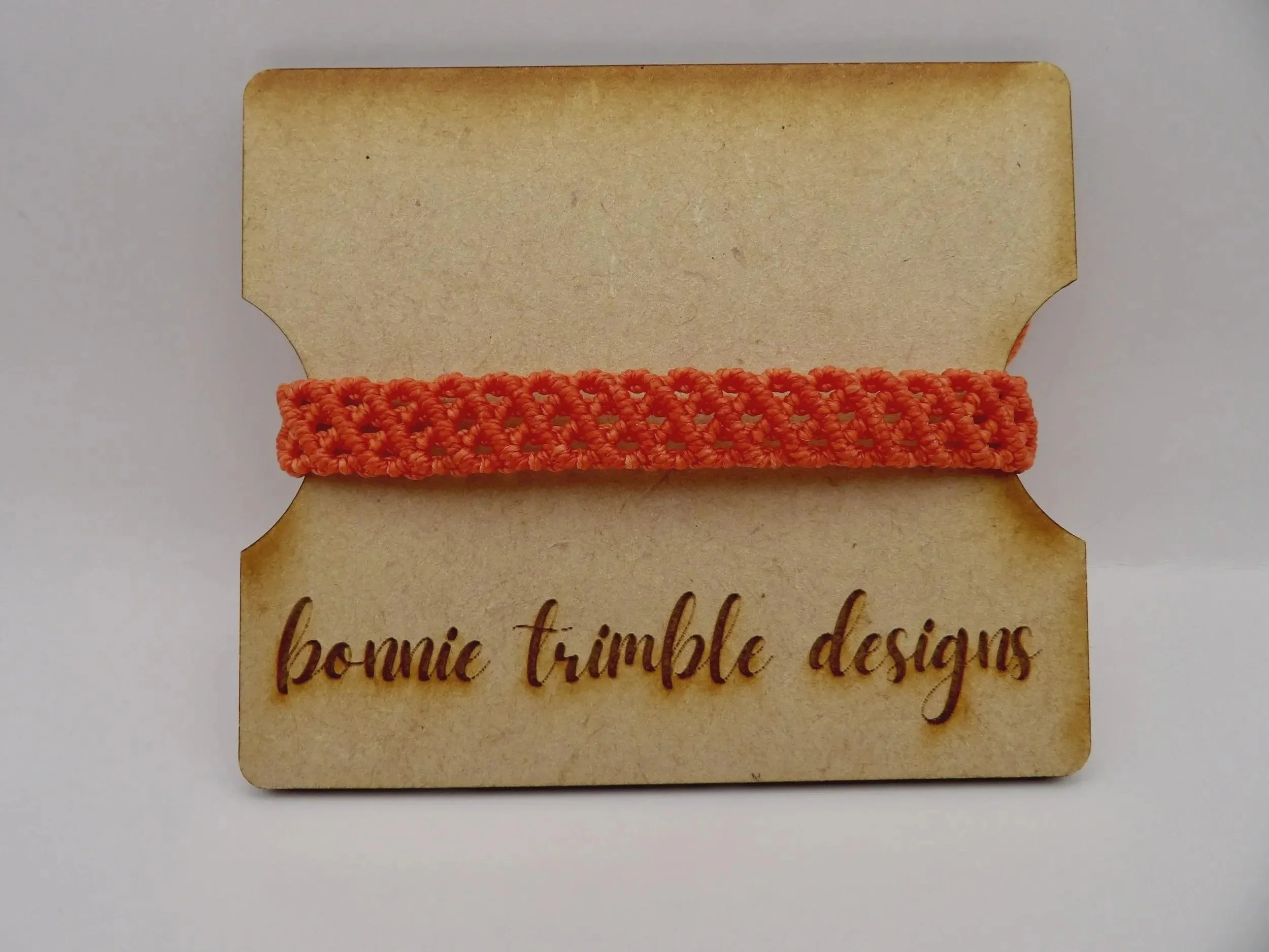 handcrafted micro-macramé jewelry designed for a textural aesthetic, available in various signature brand colors.