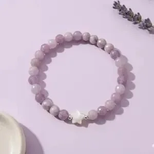 an elegant and lightweight gemstone anchor bracelet designed for a "soft romantic" or cosmic aesthetic, featuring a seamless stretch fit.