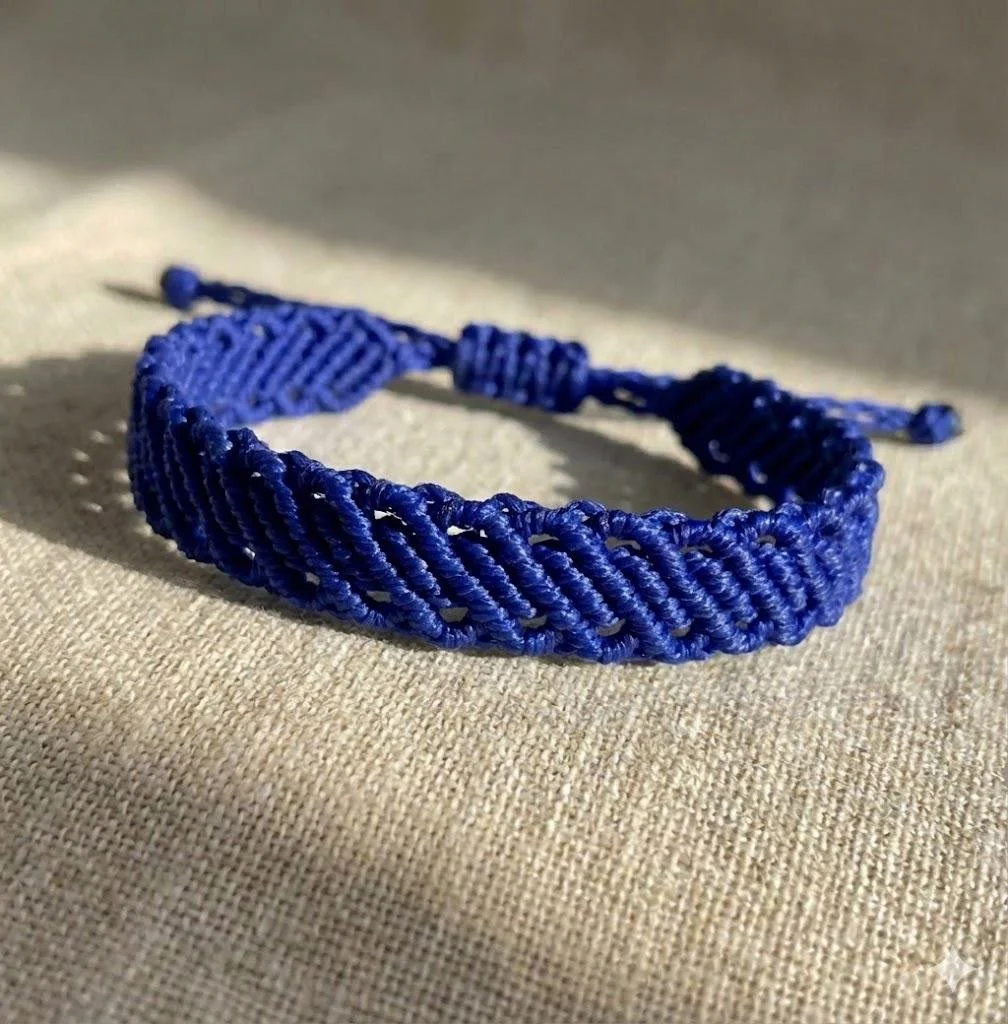 a layered-look micro-macramé bracelet in a custom colorway with a secure adjustable sliding knot closure.