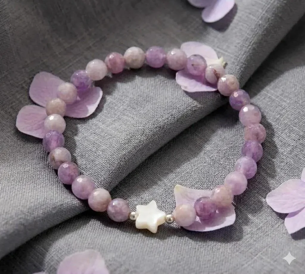 close-up of the lavender wish bracelet highlighting the smooth, premium cut of the jade beads and the delicate celestial details of the pearl star.
