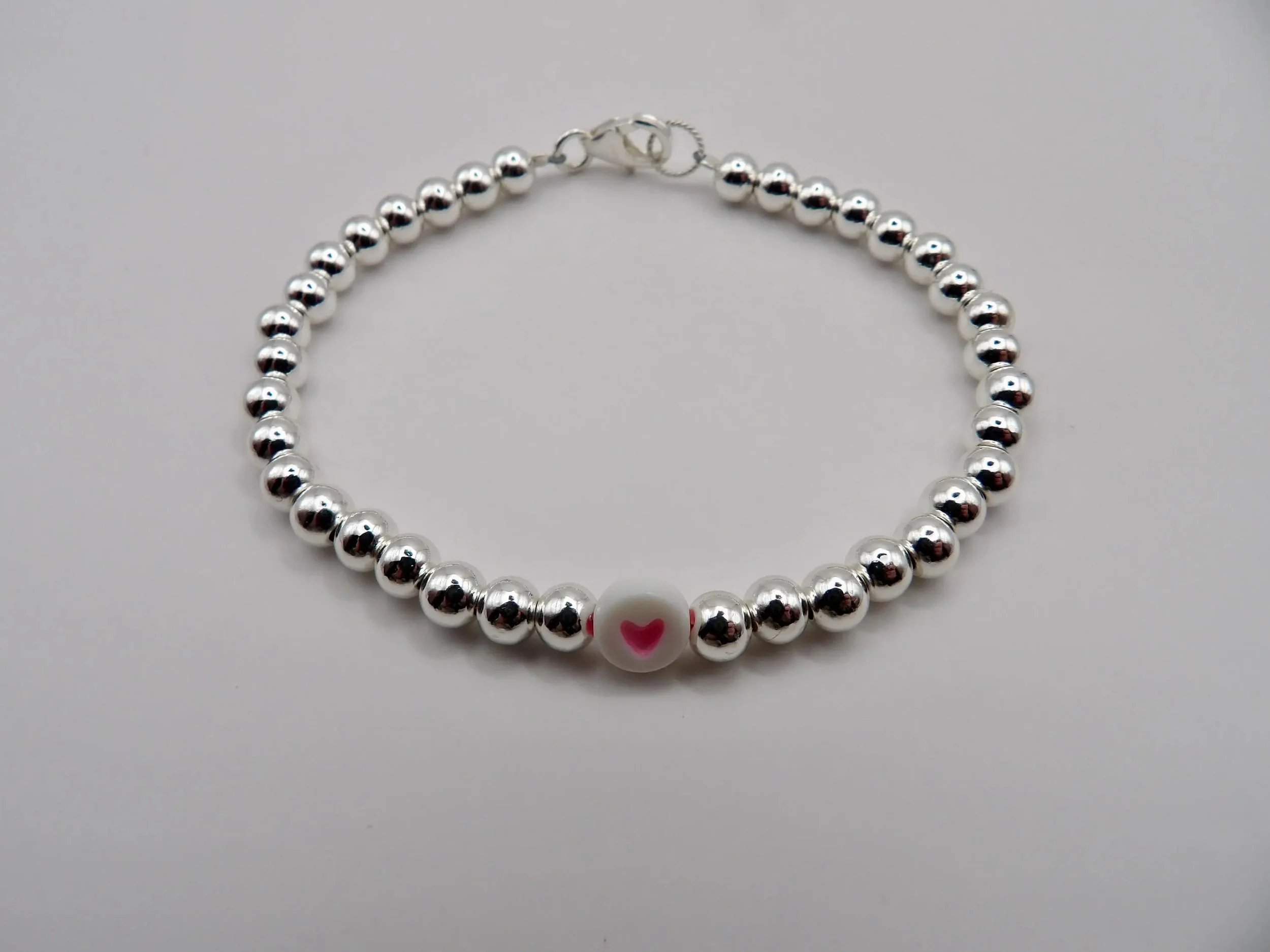 an elegant and hypoallergenic sterling silver anchor bracelet, perfect for bridesmaids, birthdays, or "sweet" sentimental gifting.