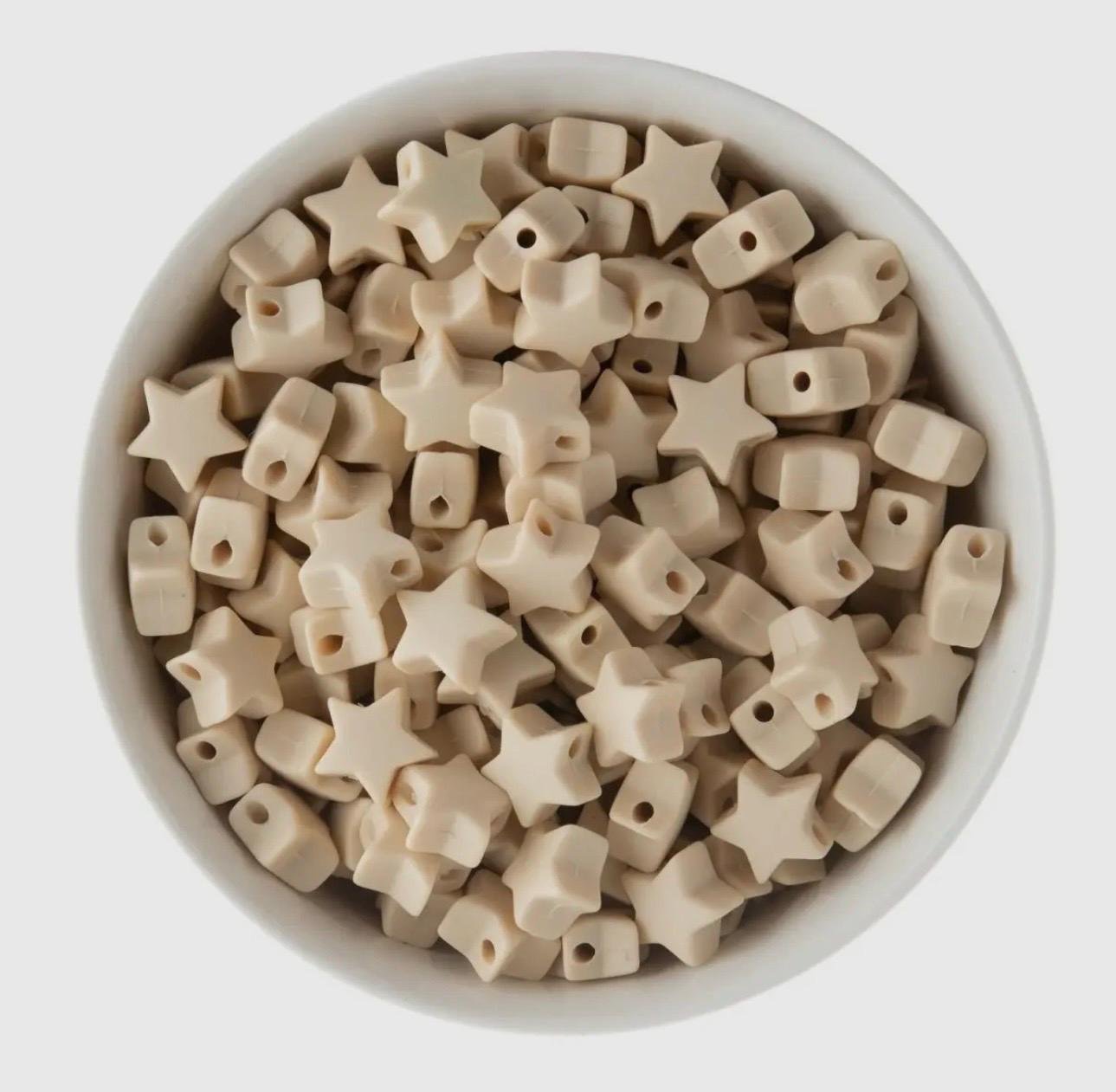 stacking gold bead bracelet with a central silicone star bead available in a variety of fun colors.