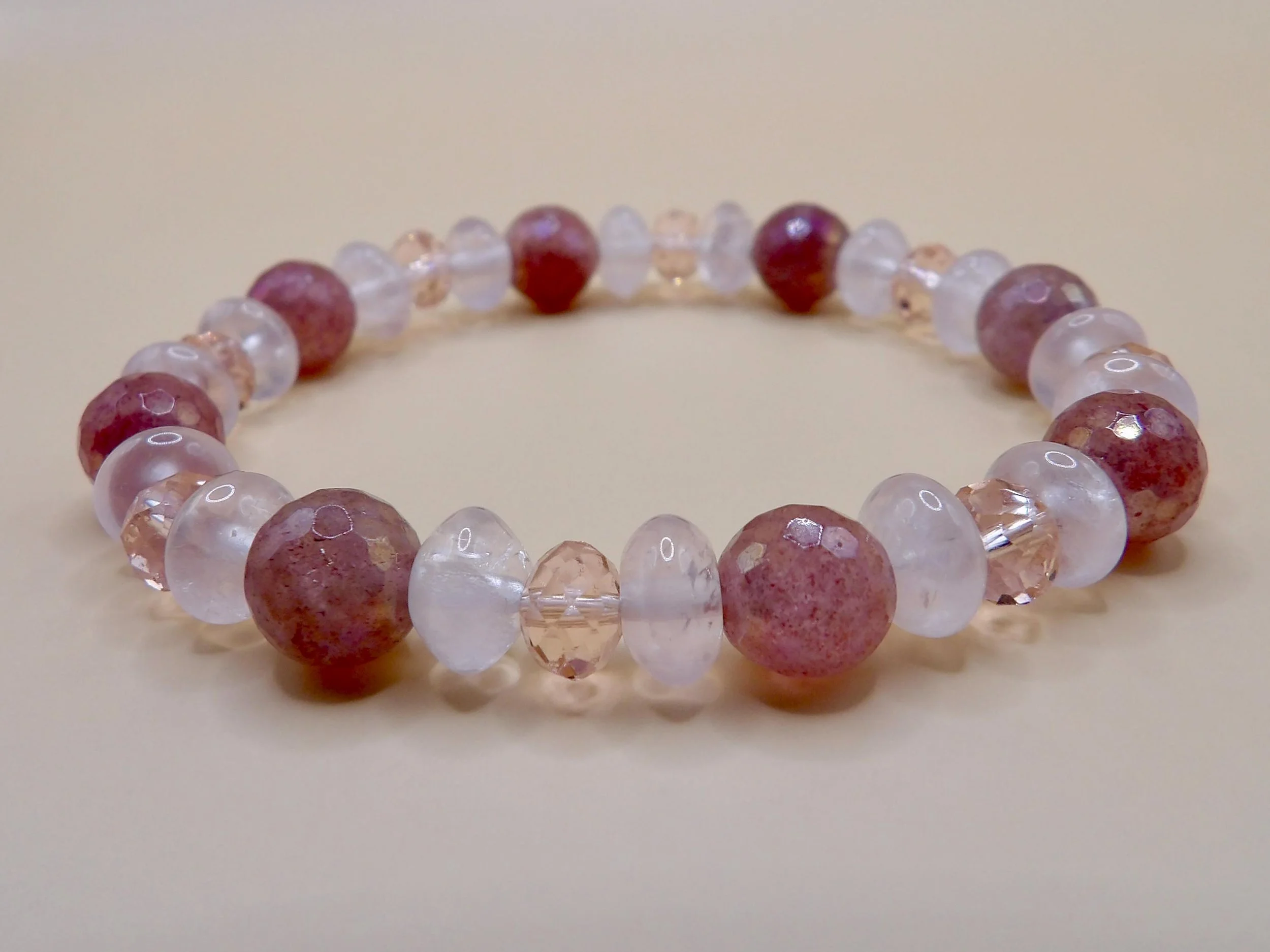 a coordinated gemstone duo featuring natural strawberry quartz and rose quartz for a "monochrome pink" luxury look.