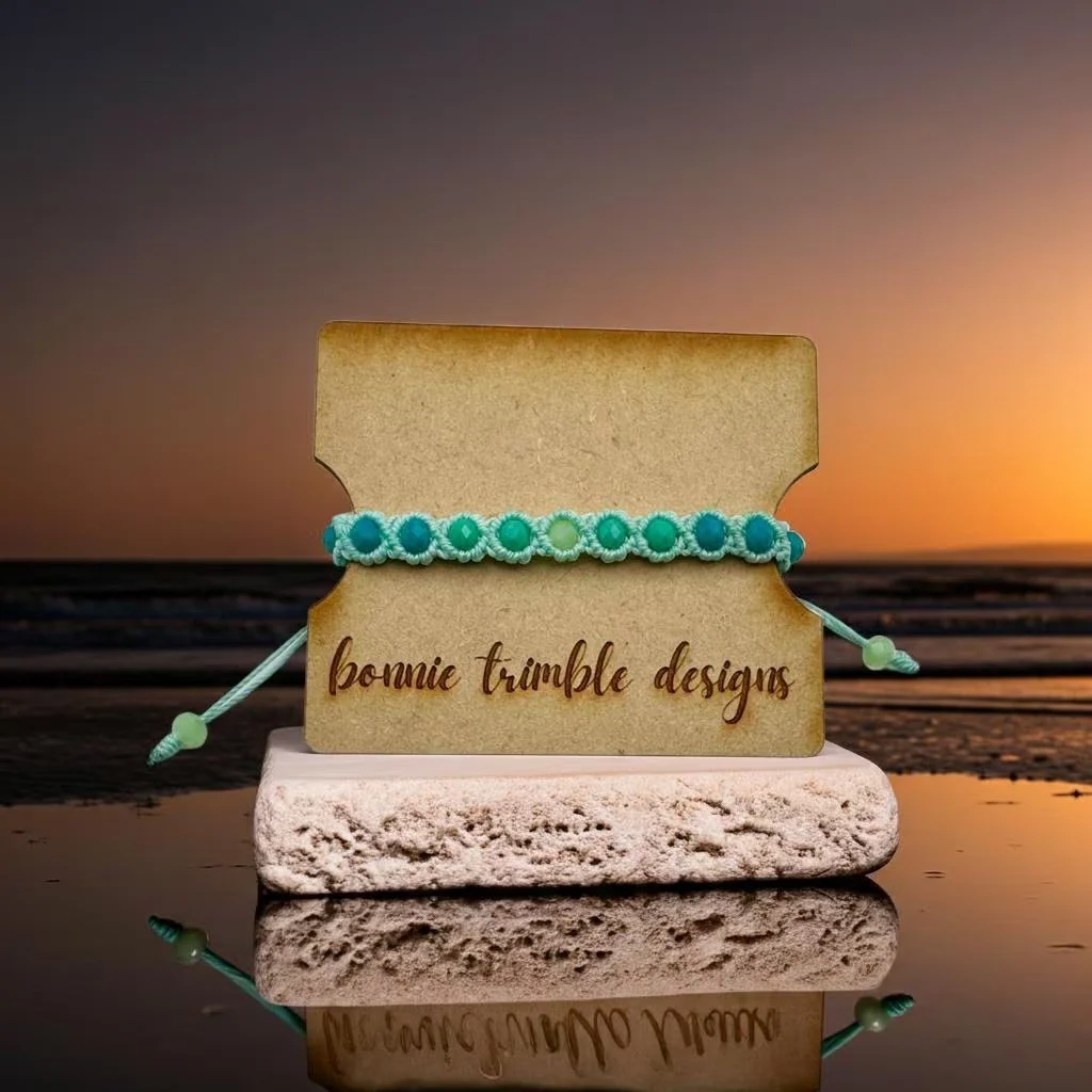a waterproof and beach-ready hand-woven bracelet showing the sea-glass inspired ombre effect and adjustable sliding knot.
