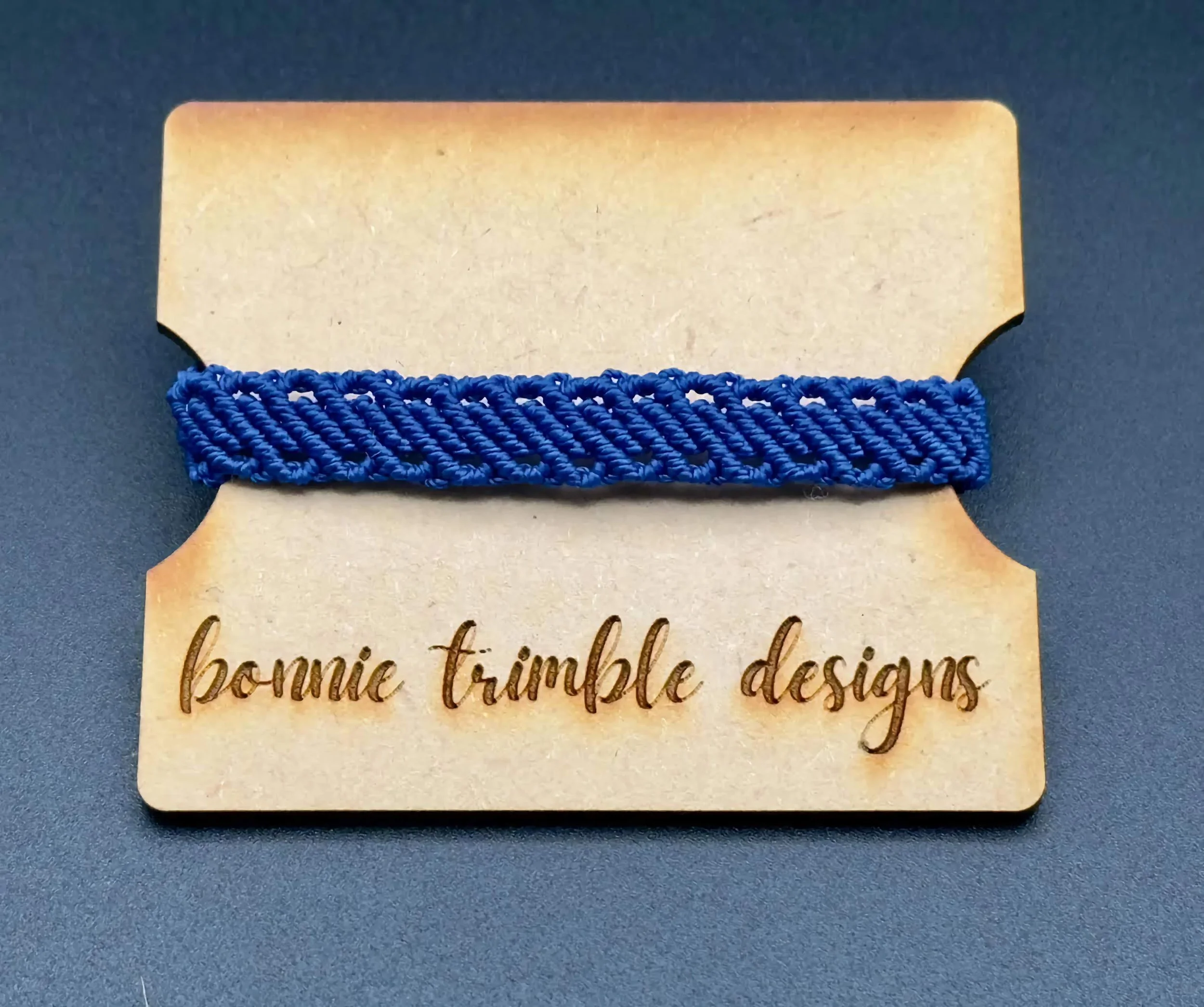 handmade royal blue micro macrame bracelet featuring a multi-row design that looks like a stack.