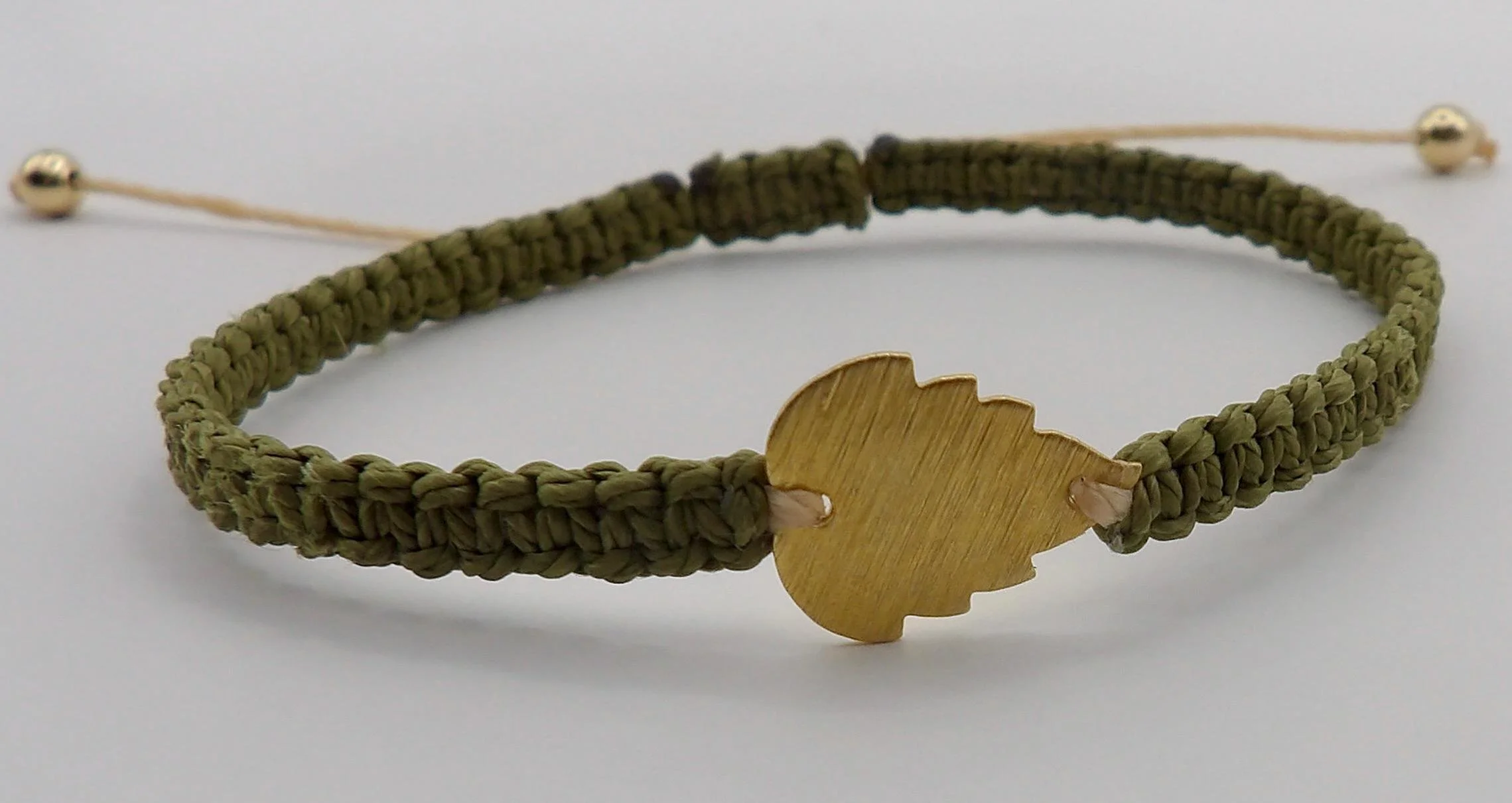 handcrafted nature-inspired jewelry featuring an adjustable sliding knot and a premium tarnish-resistant gold olive branch symbol.