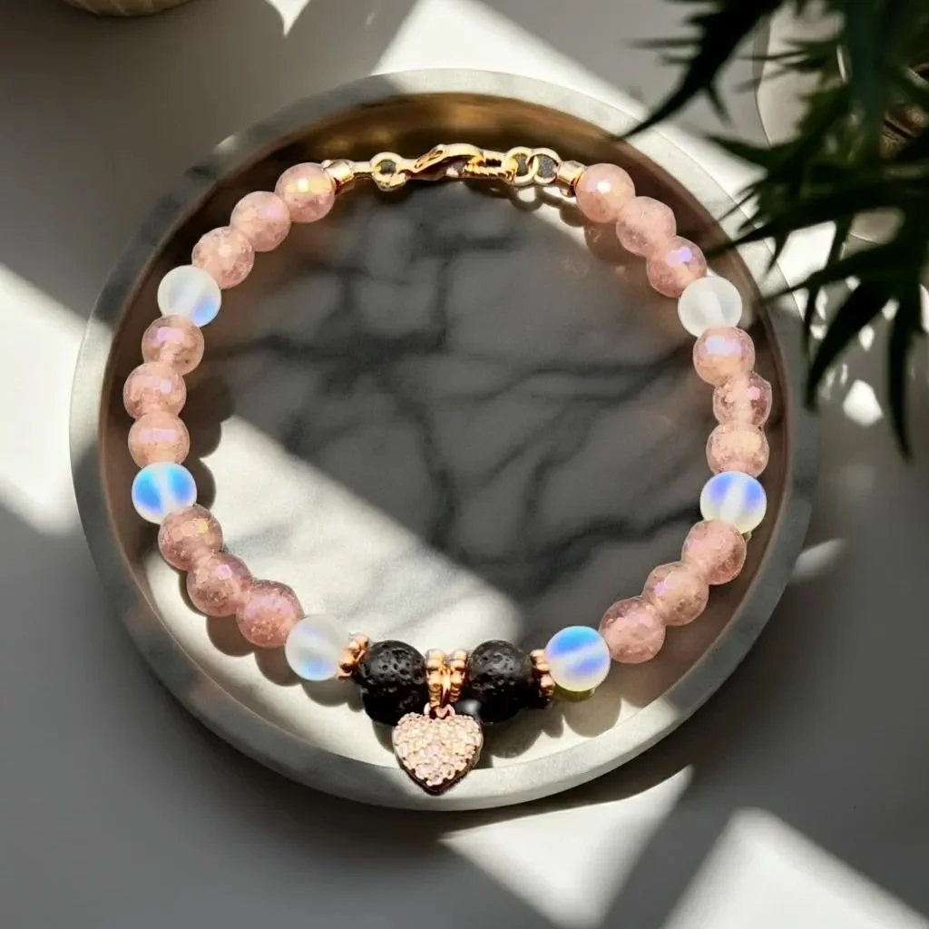 handcrafted strawberry quartz jewelry with a rose gold pavé heart focal point and essential oil diffusing lava stones.