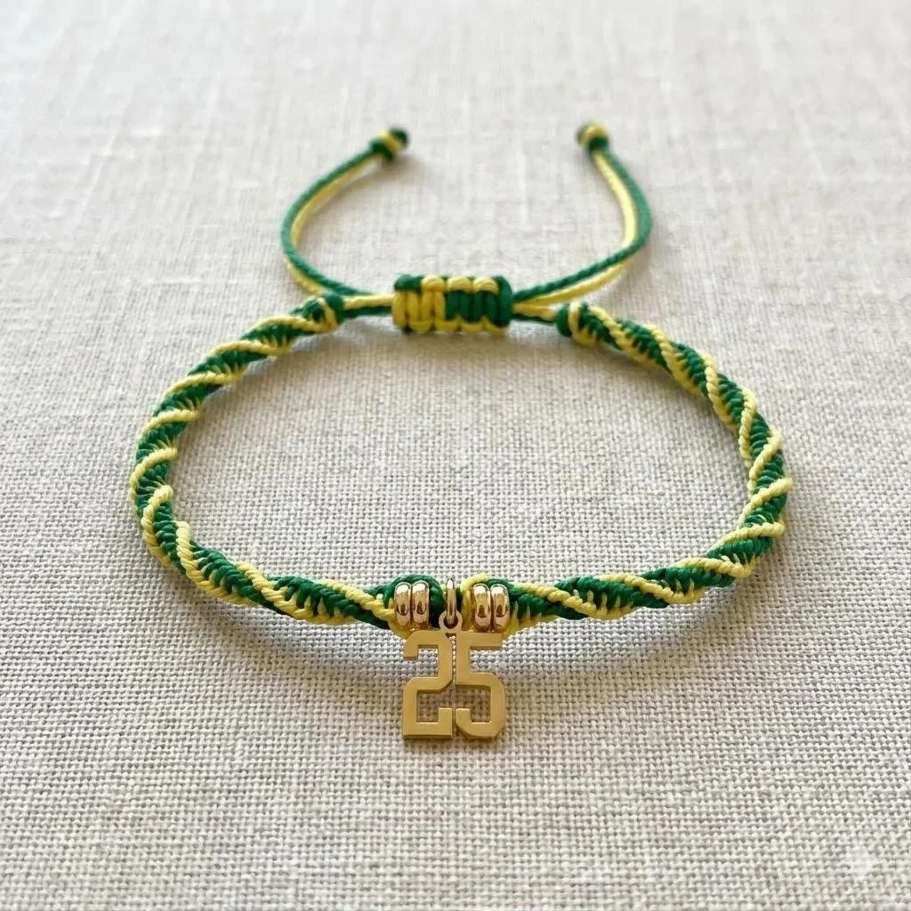 Custom green and yellow twisted macramé bracelet with an 18k gold PVD number charm.