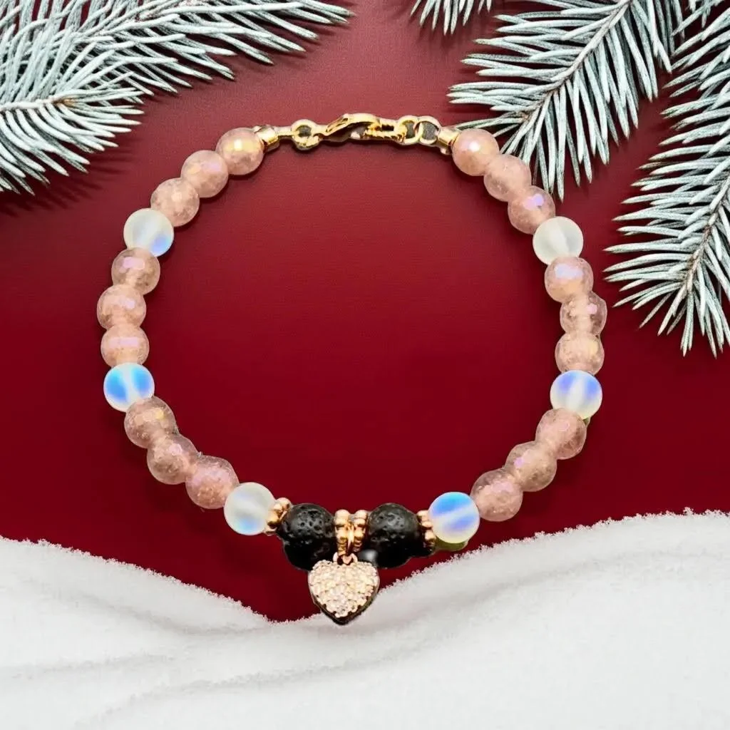 close-up of the dreamy romantic bracelet highlighting the delicate red inclusions in the strawberry quartz and the rose gold hardware.