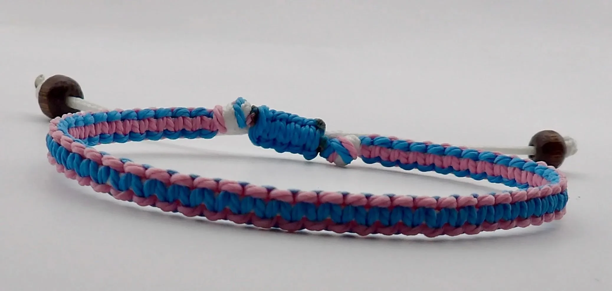 Handcrafted two-tone playground pioneer bracelet made by a local Pearland artisan, available in multiple custom color pairings.