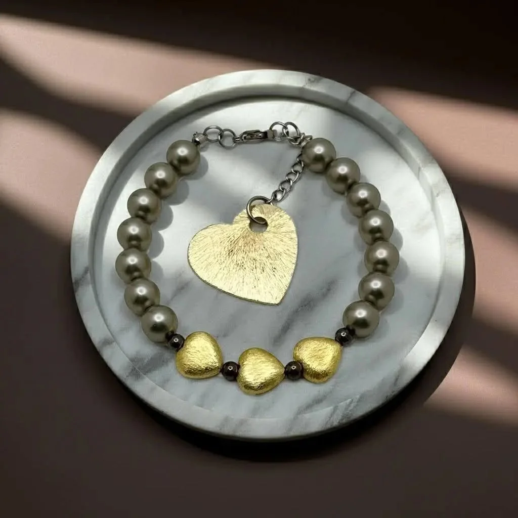 handcrafted dark romantic aesthetic bracelet with adjustable cord and shimmering metallic hematite beads.