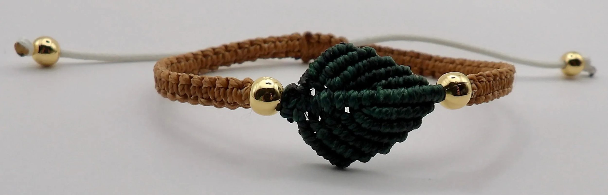 earthy micro-macramé leaf stack with gold bead accents and durable waterproof cord for daily wear.