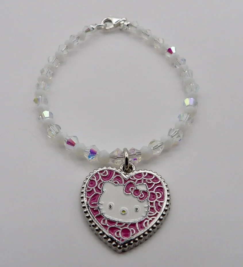 handmade .925 sterling silver bracelet with alternating white and ab crystal beads, featuring a central pink mosaic hello kitty heart charm.