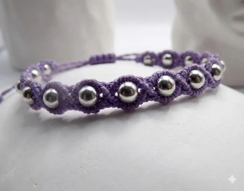 hand-knotted weighted macramé bracelet featuring high-quality stainless steel accents and a secure adjustable closure.