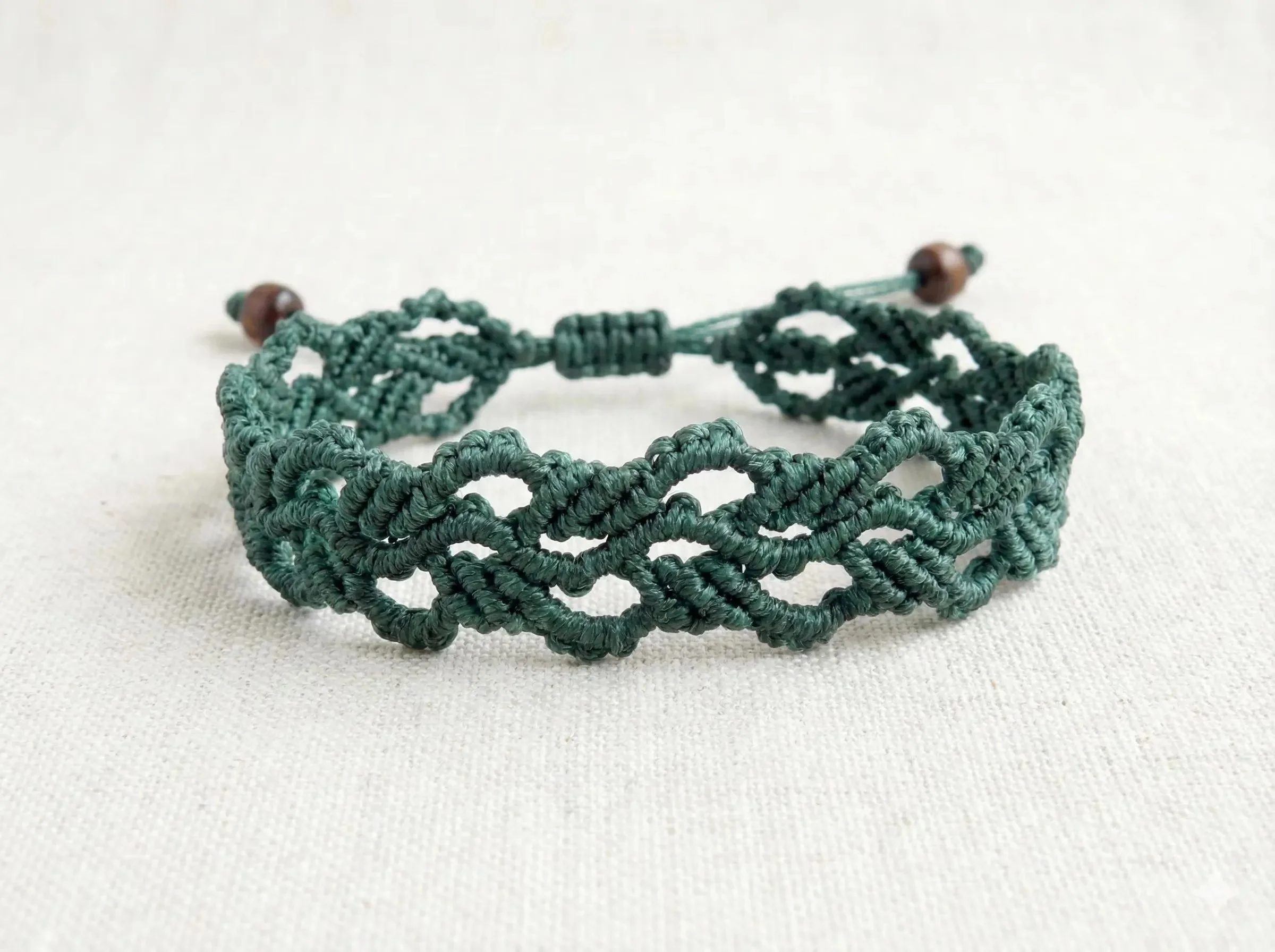 handcrafted waterproof micro-macramé jewelry designed for durability and a "nature-luxe" aesthetic, available in bespoke colors.