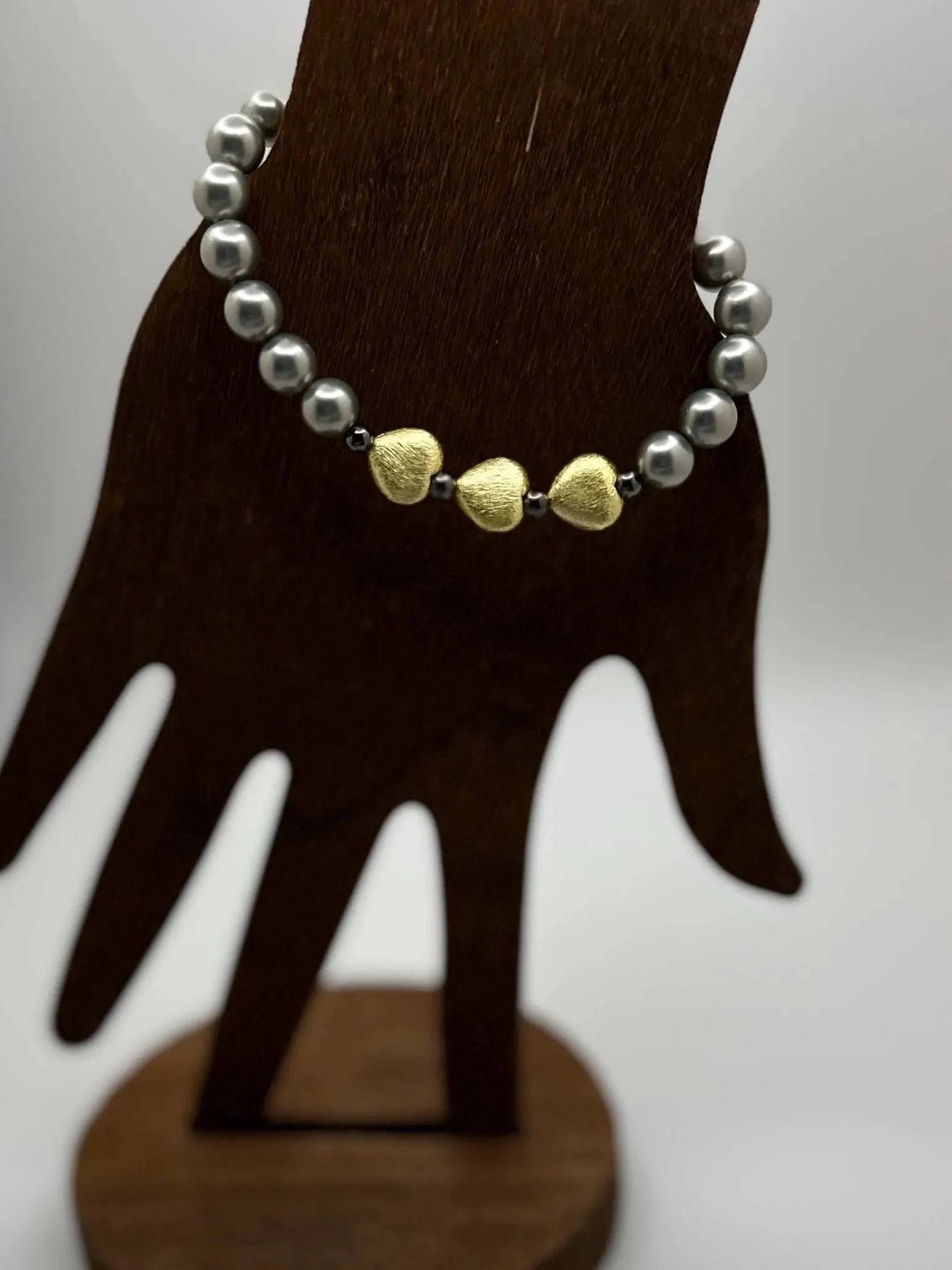 a luxury take on gothic romance jewelry using genuine gunmetal mother of pearl and precious metal finishes.