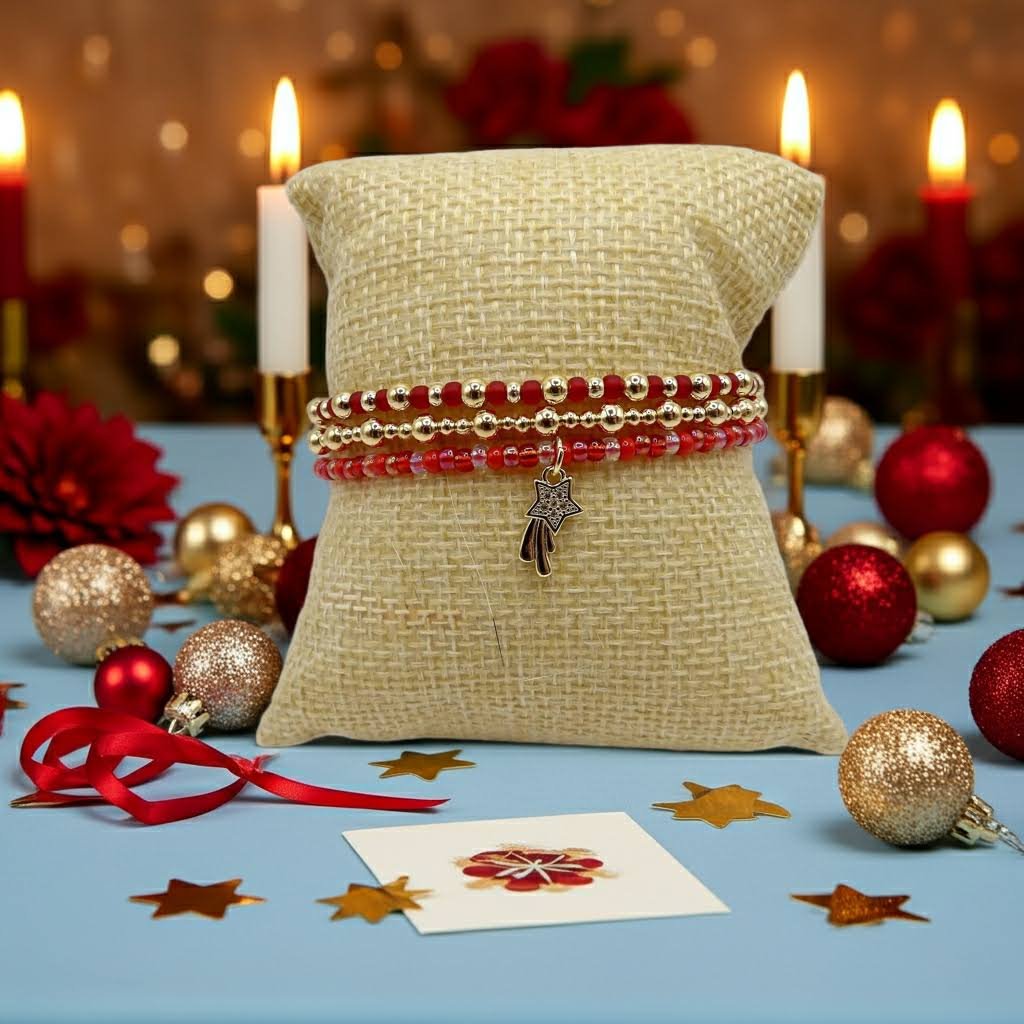 holiday gift photo of the solid gold shooting star bracelet set tabletop with ornaments and confetti.