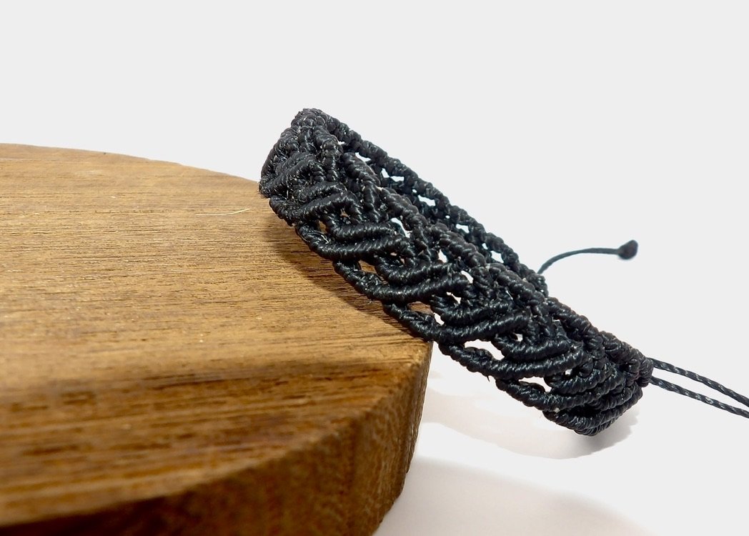 handmade black micro macrame adjustable bracelet featuring an intricate, lacy scrollwork weave pattern. other colors available.