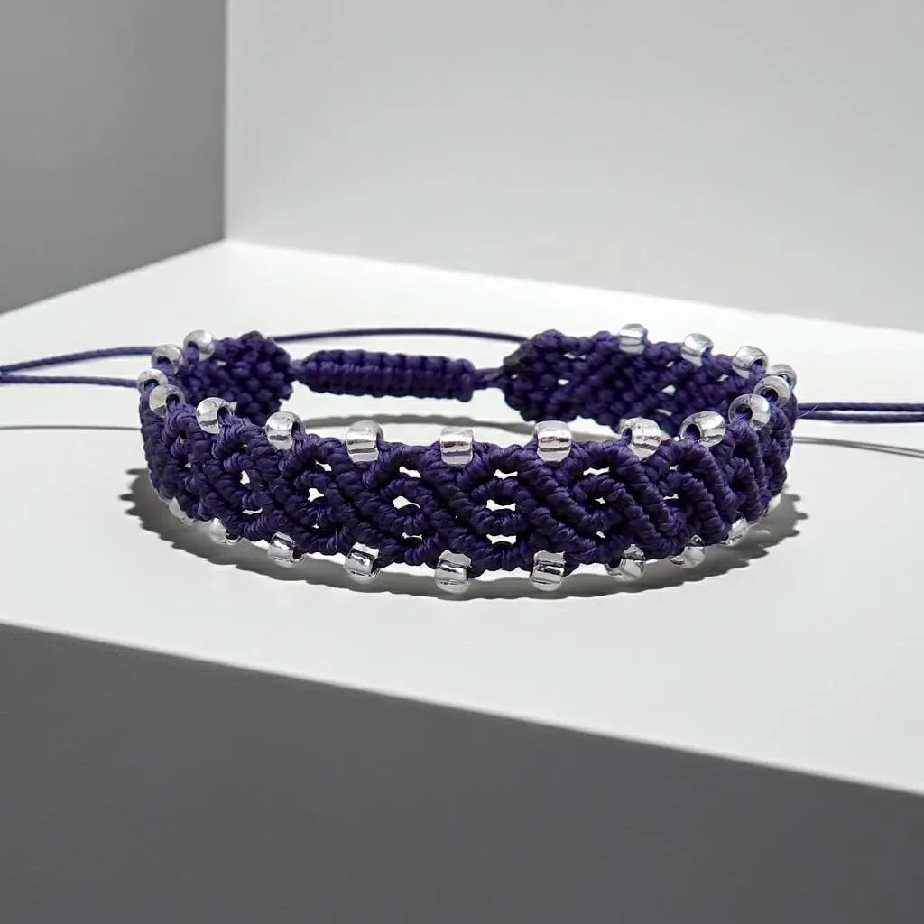 close-up of the bohemian artisan bracelet highlighting the interior glow of the glass beads woven into the high-tension cord.