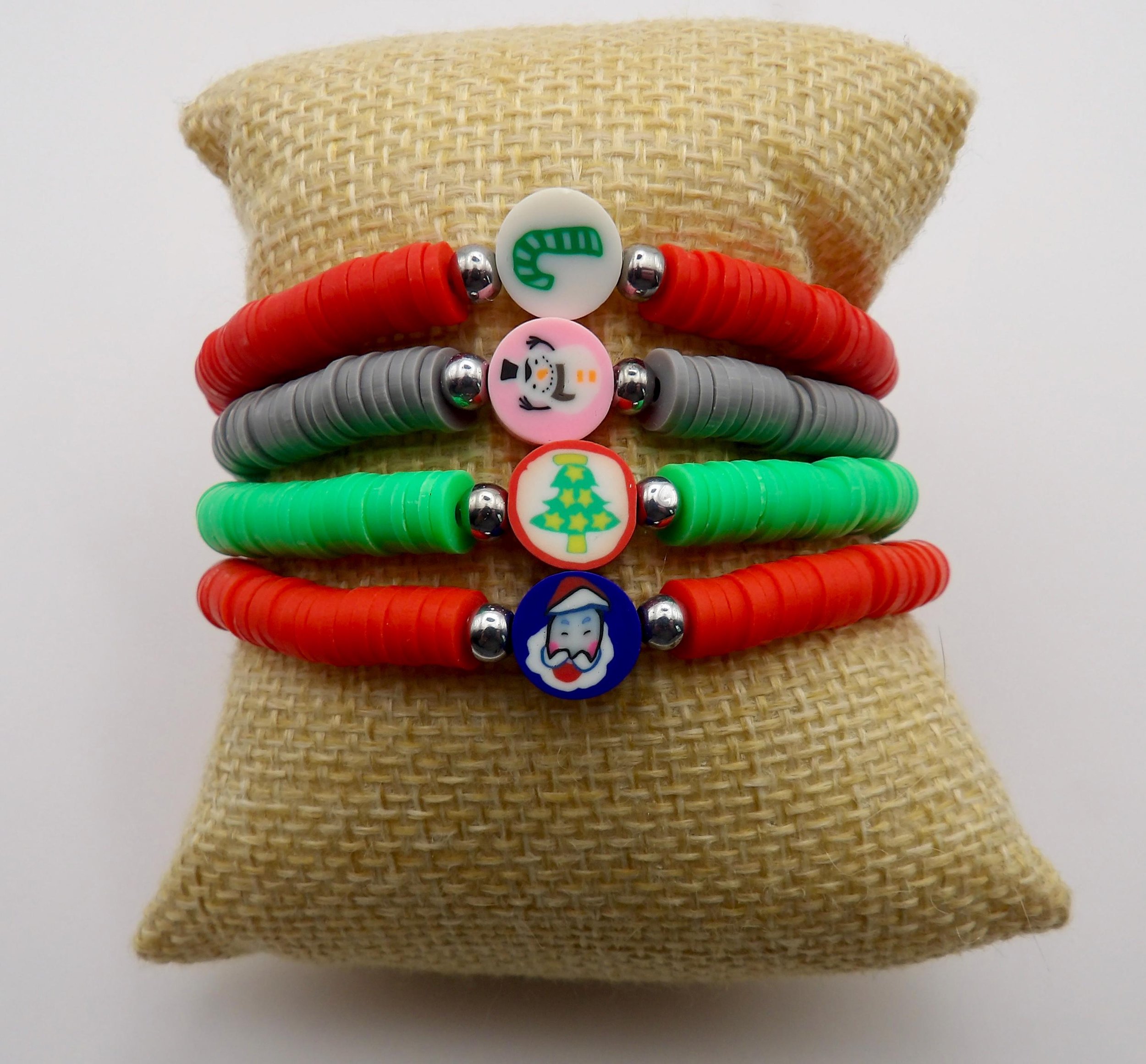 a playful and festive beaded stretch bracelet designed for the holiday season with customizable heishi colors.