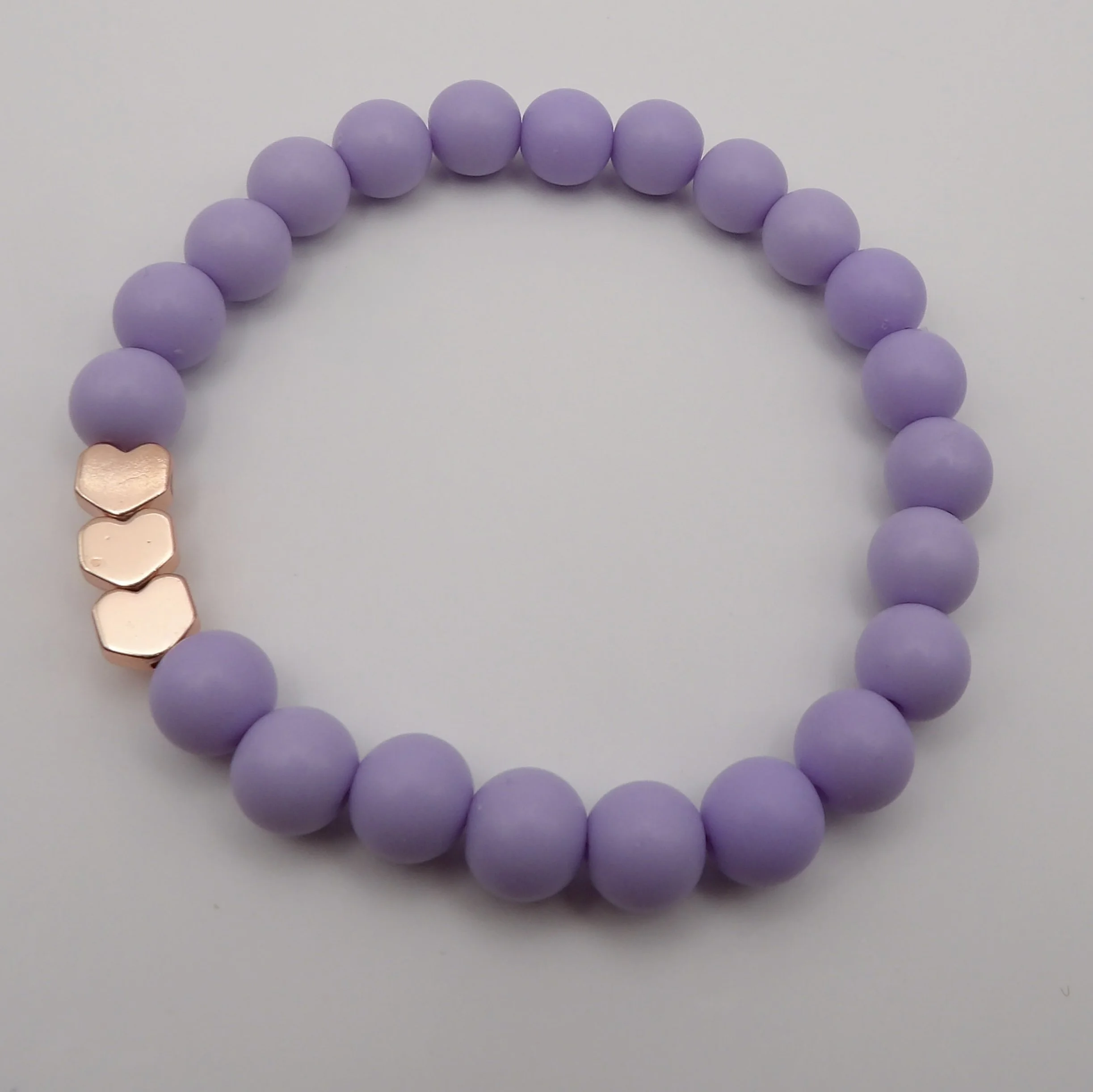 sweet dreams matte heart bracelet in soft purple with a shiny rose gold heart accent bead.