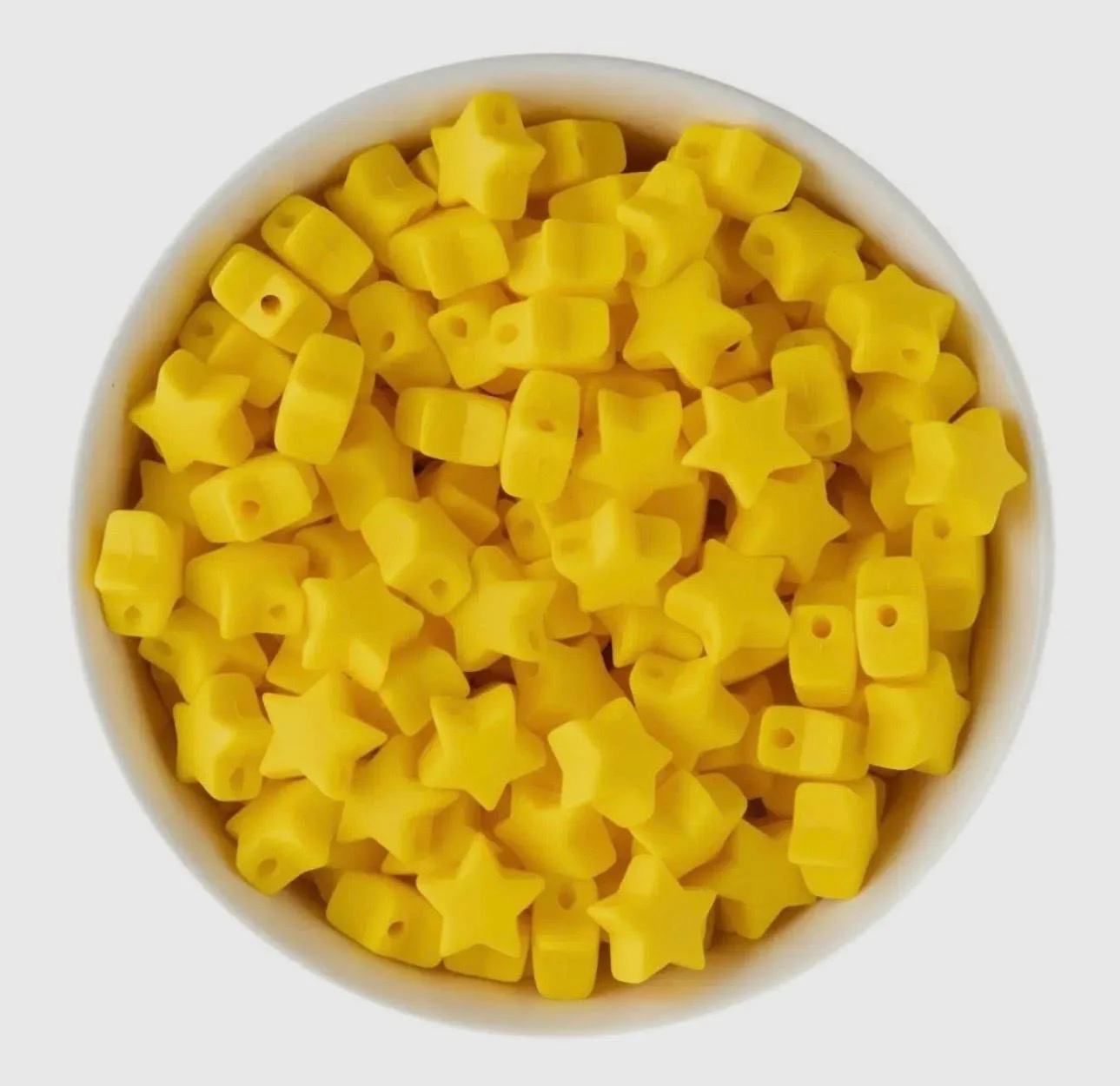 colorful star focal bead on a string of 18k gold plated beads, perfect for layering and stacking.