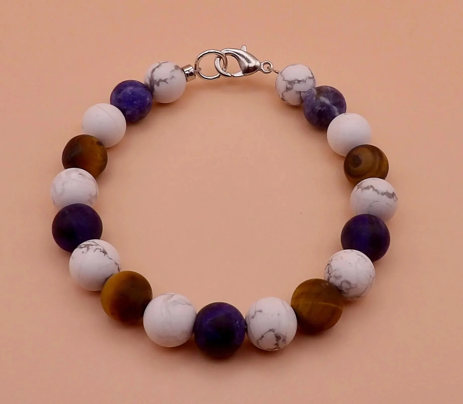 the modern stoic bracelet displayed on a concrete background to emphasize its masculine, durable, and grounded design.