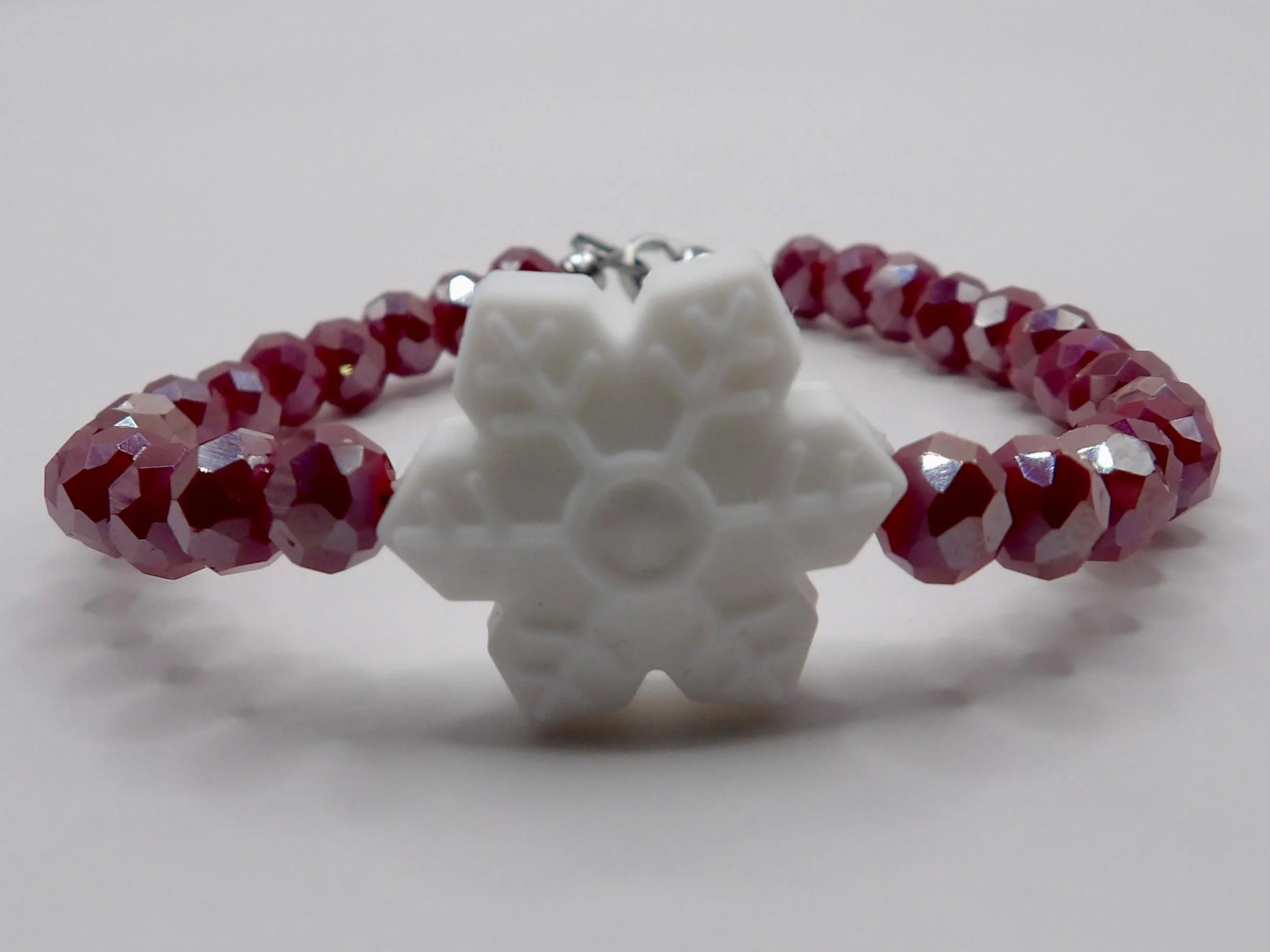 a versatile holiday gift bracelet available in bespoke colors, featuring a signature winter sparkle design.
