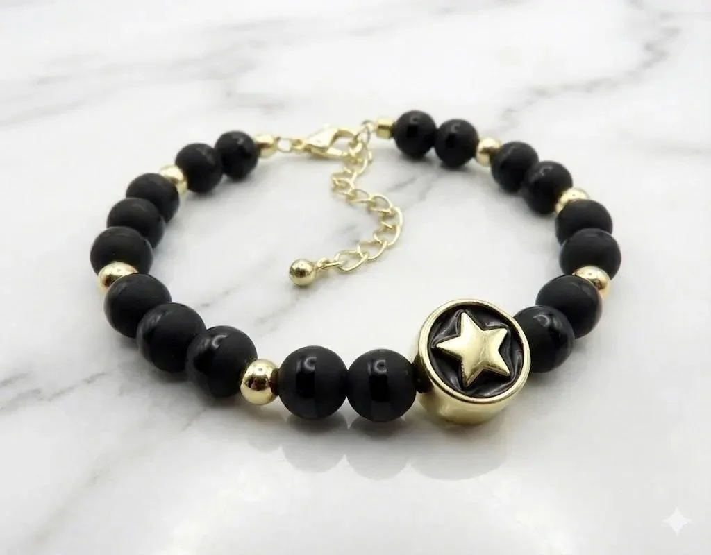 handcrafted tarnish-resistant jewelry featuring genuine tuxedo black onyx beads and a premium 18k gold-plated cosmic star accent.
