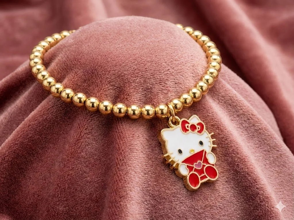 Handmade 18k solid gold beaded bracelet set featuring enamel Hello Kitty charms. Luxury best friend gift with solid gold clasps.