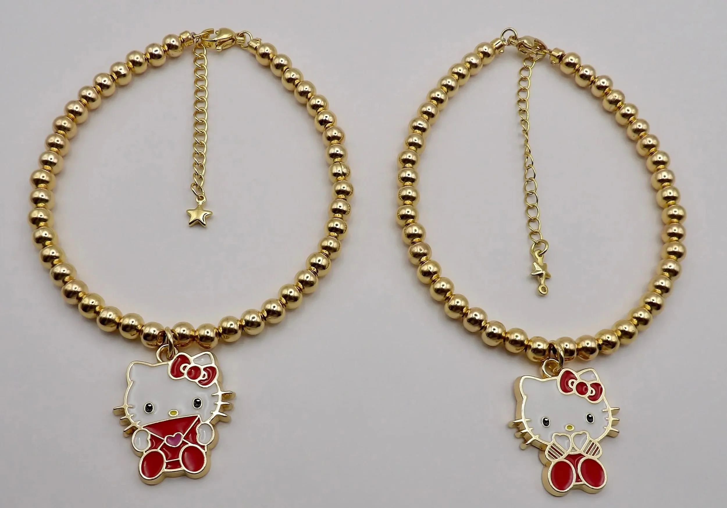 a premium take on a friendship classic featuring 18k gold filled hardware and a minimalist hello kitty silhouette.