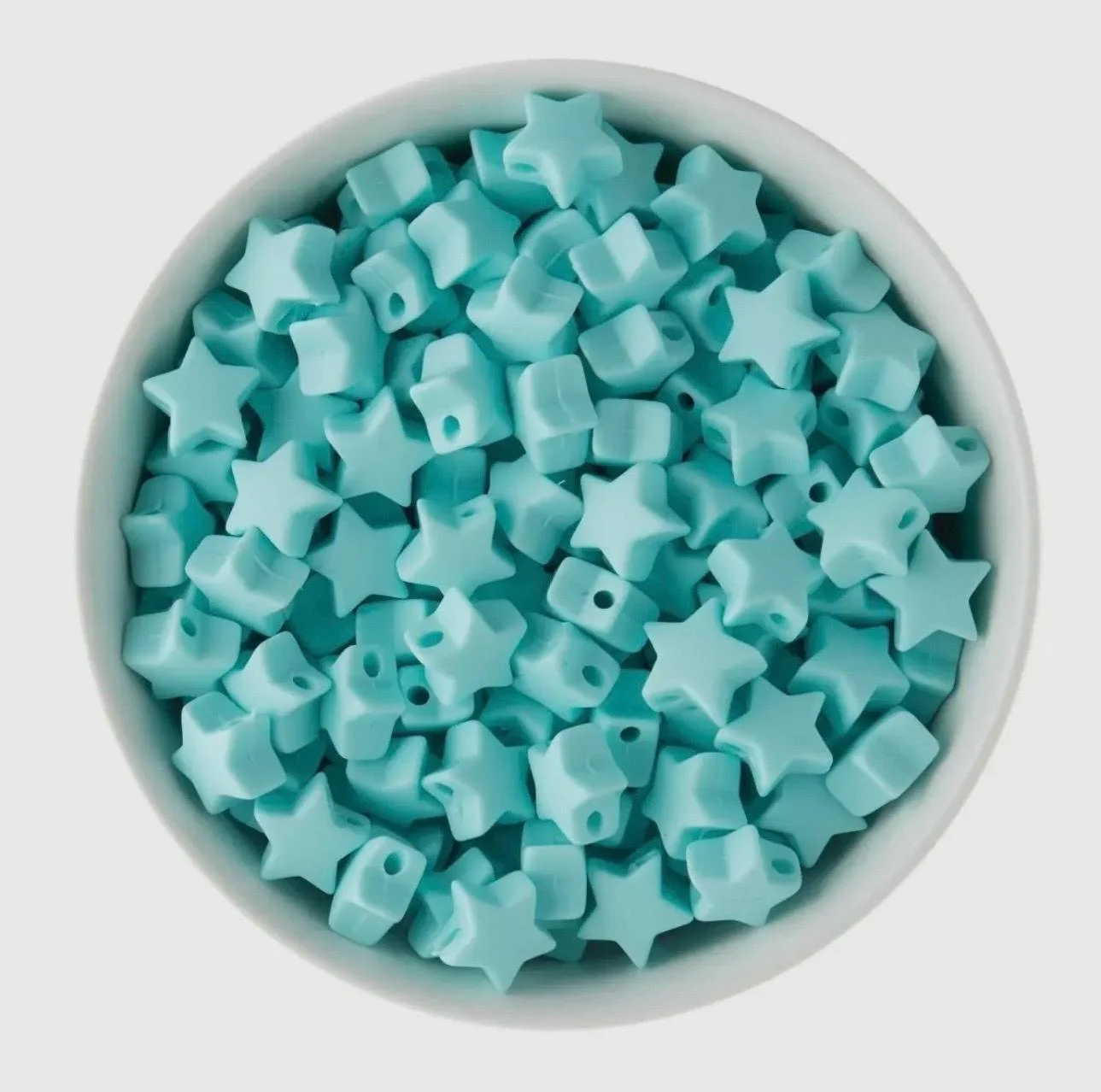 custom color star bracelet for kids and teens with premium 18k gold plated hardware and a soft silicone star.