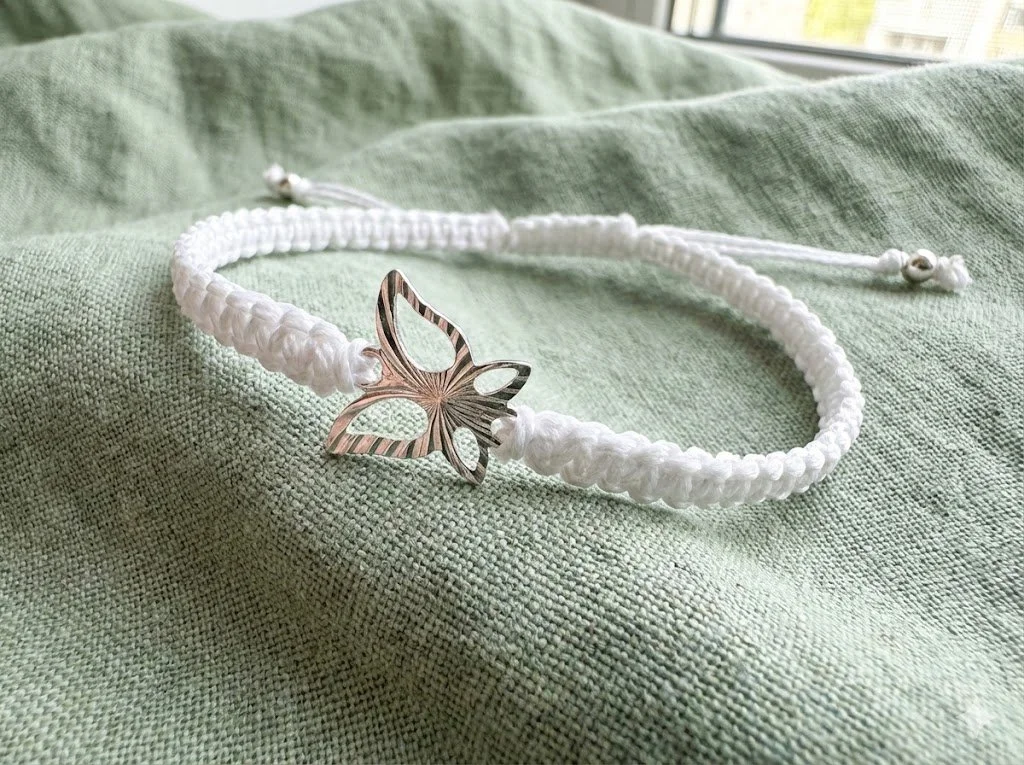 the silver‑wing bracelet | white macramé + 925 sterling silver butterfly | adjustable knot