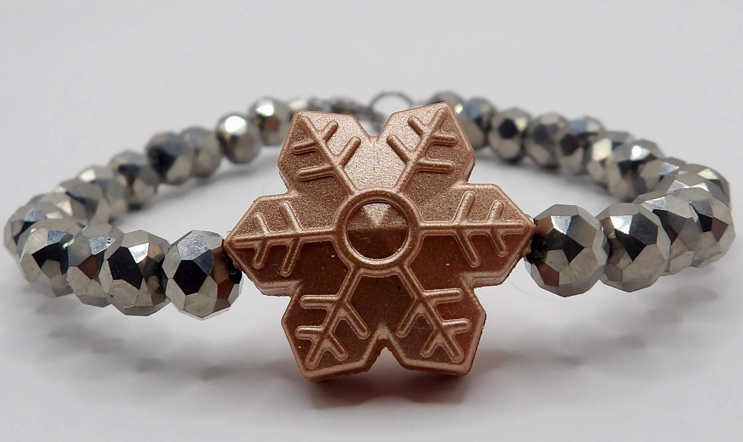the winter sparkle bracelet showcasing its durable stretch construction and vibrant, customizable bead palette.